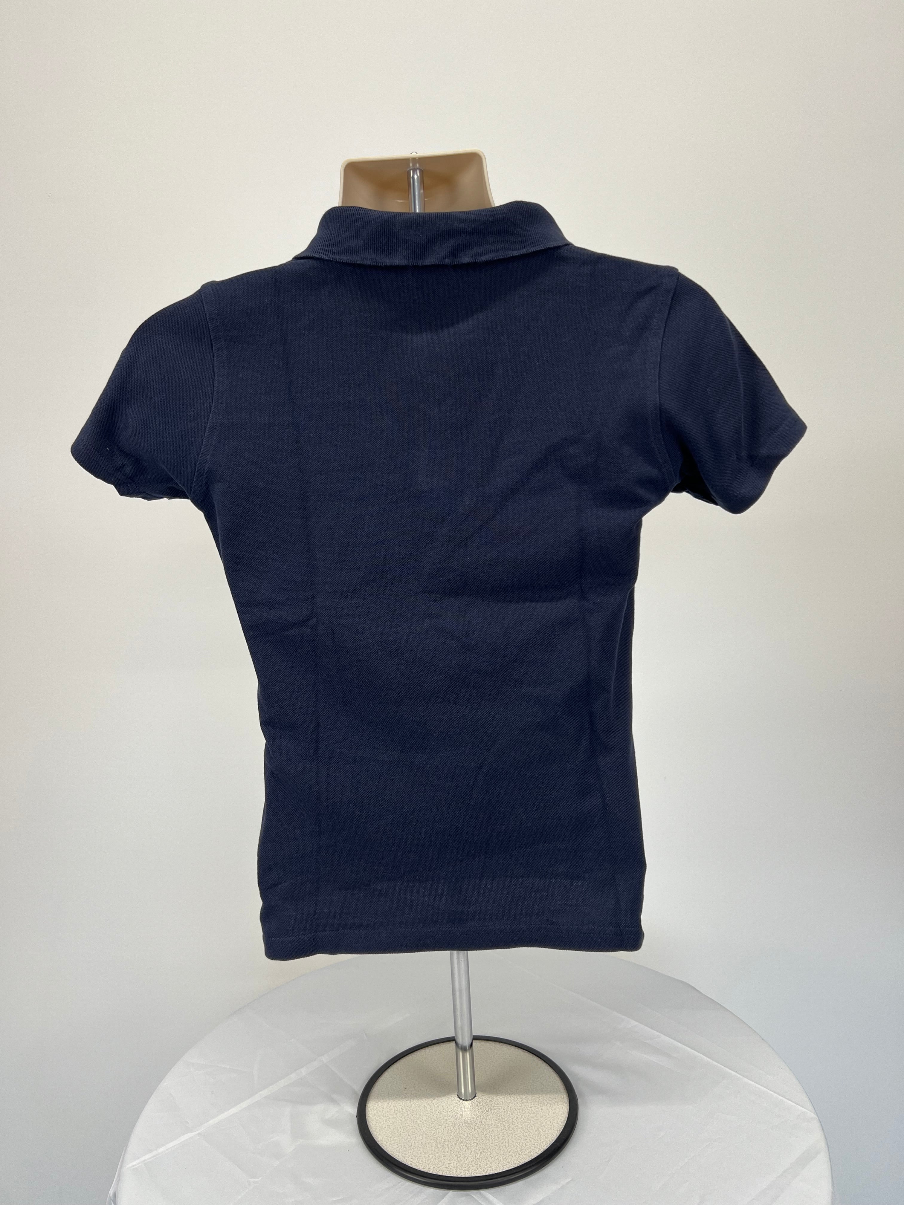 Back view of navy blue women’s polo shirt showing plain design with short sleeves and collar