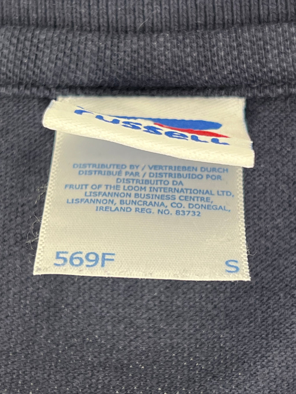 Close-up of garment label showing size Small by Russell, distributed by Fruit of the Loom International Ltd