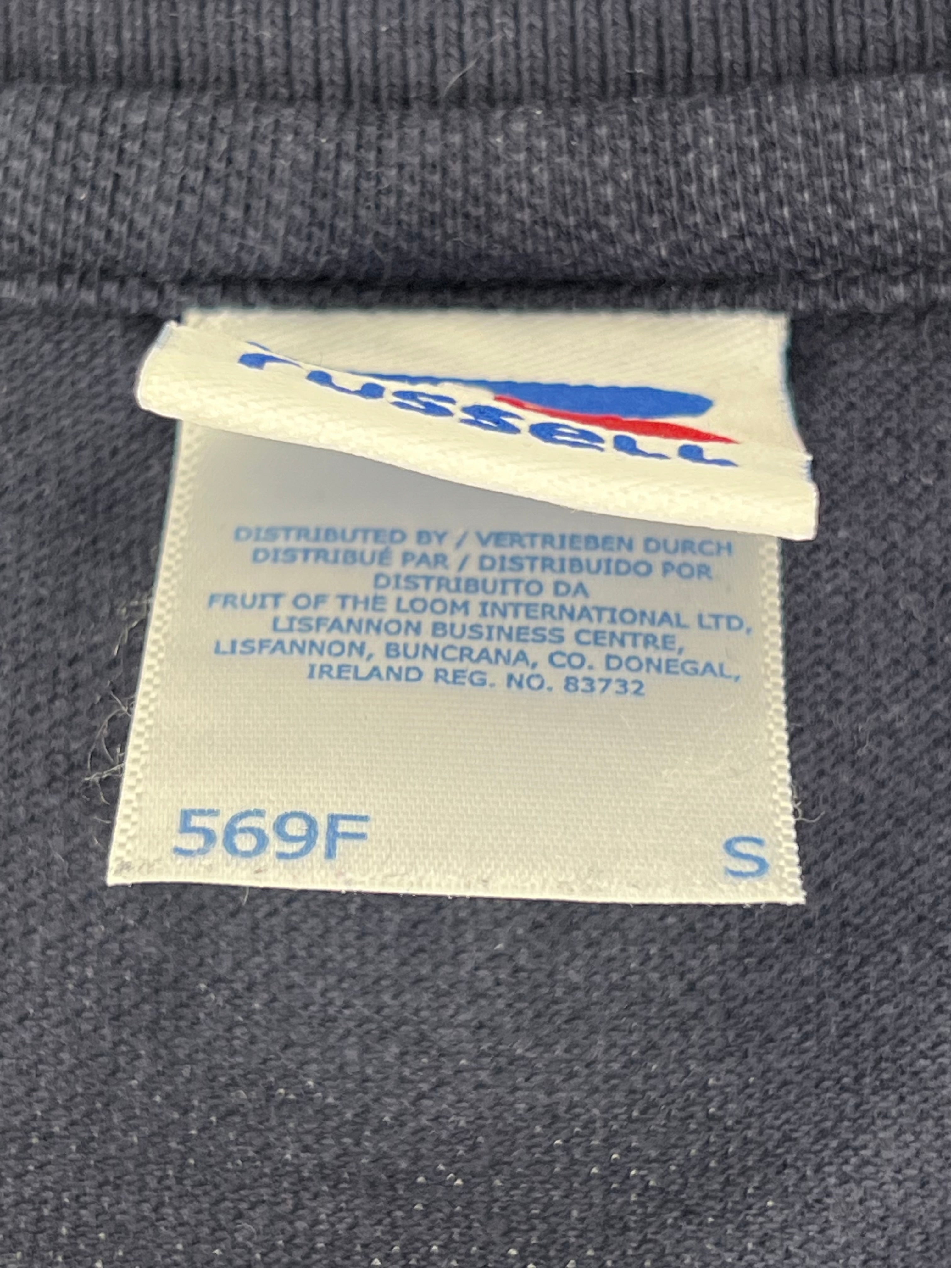Close-up of garment label showing size Small by Russell, distributed by Fruit of the Loom International Ltd