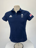 Front view of Adidas Team GB Beijing 2022 women's navy blue polo shirt with logo and Union Jack sleeve patch