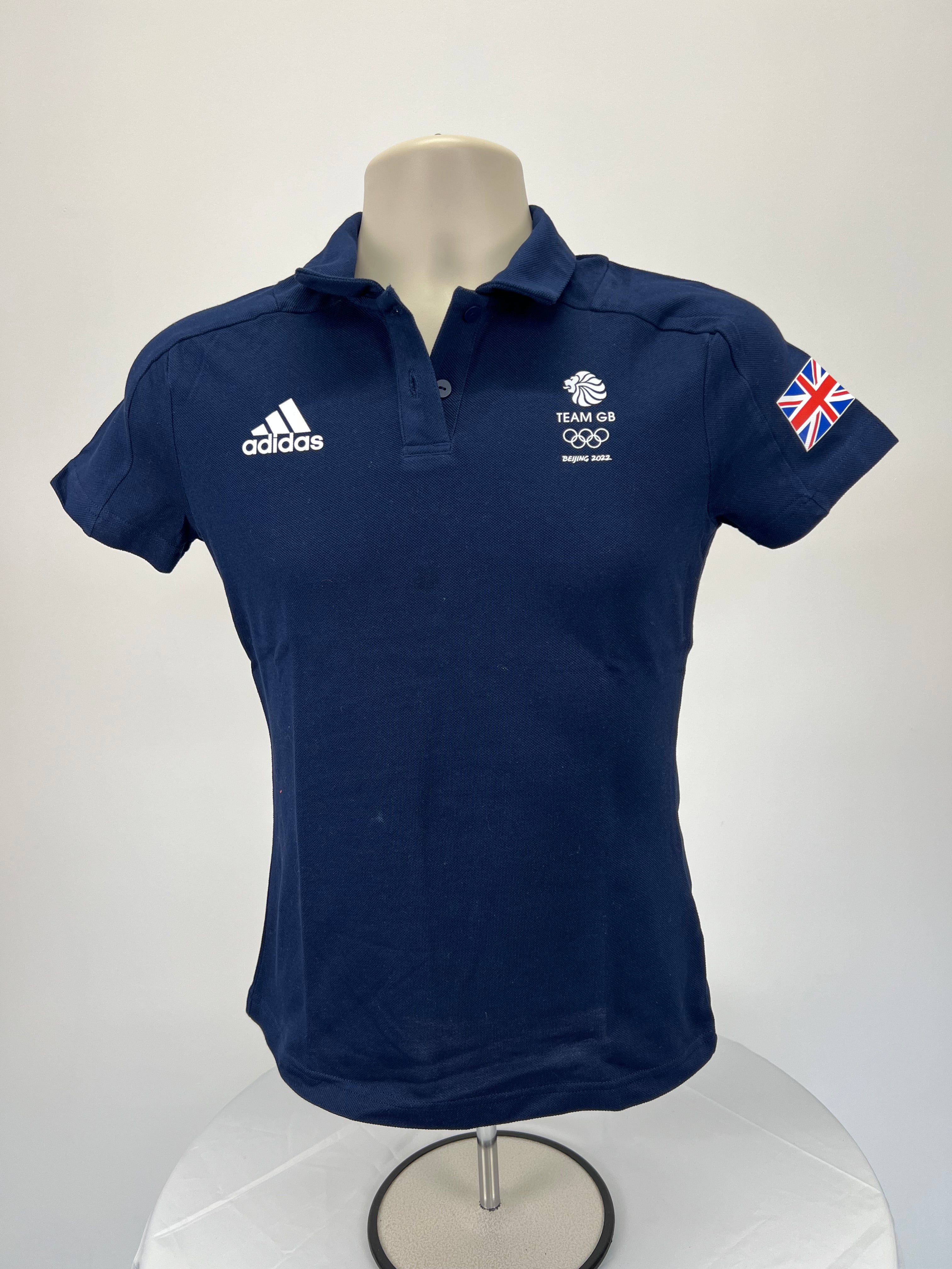 Front view of Adidas Team GB Beijing 2022 women's navy blue polo shirt with logo and Union Jack sleeve patch