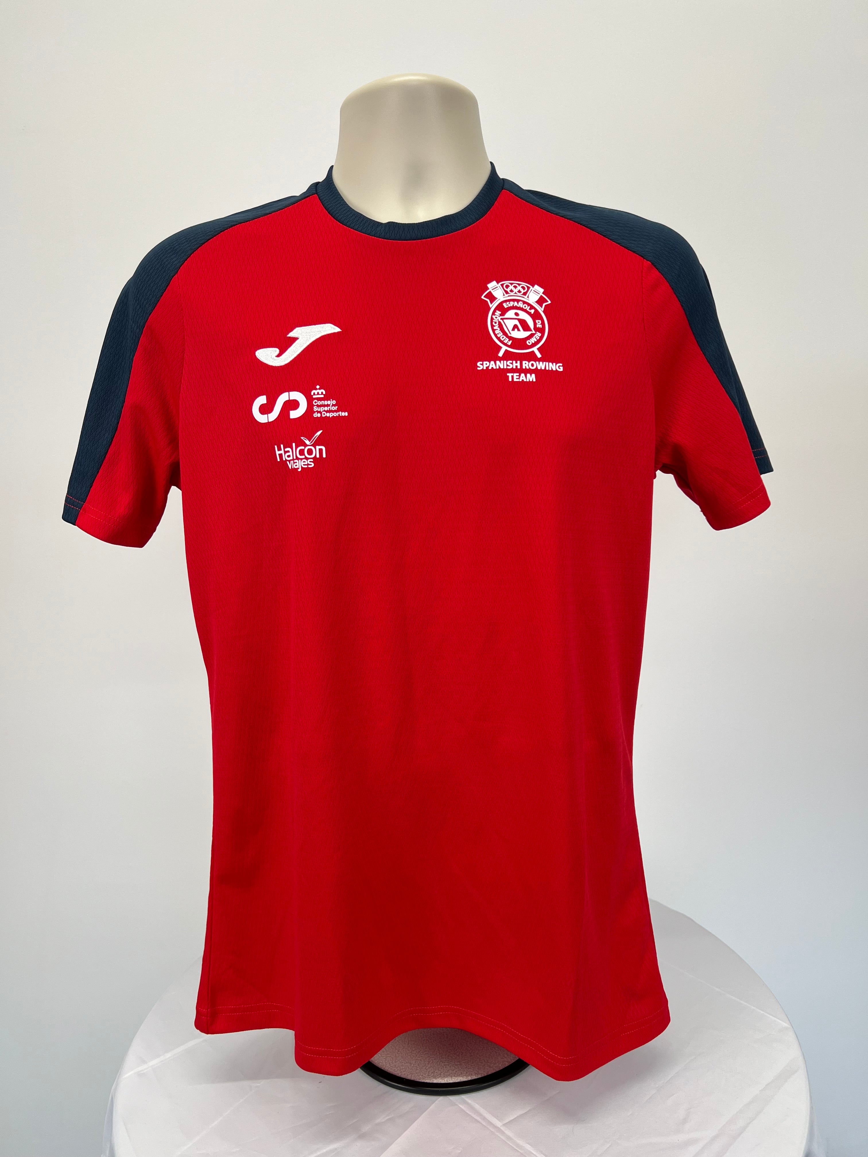 Front view of red men’s Spanish Rowing Team t-shirt with black shoulder accents and team logo