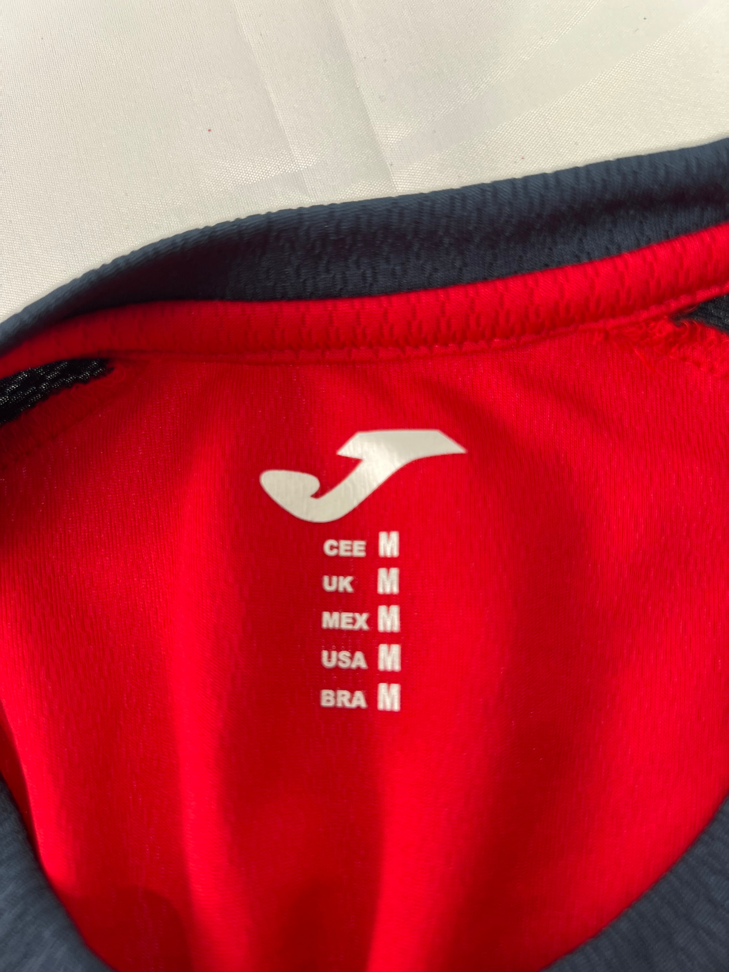 Close-up of printed size and brand logo inside collar of the t-shirt