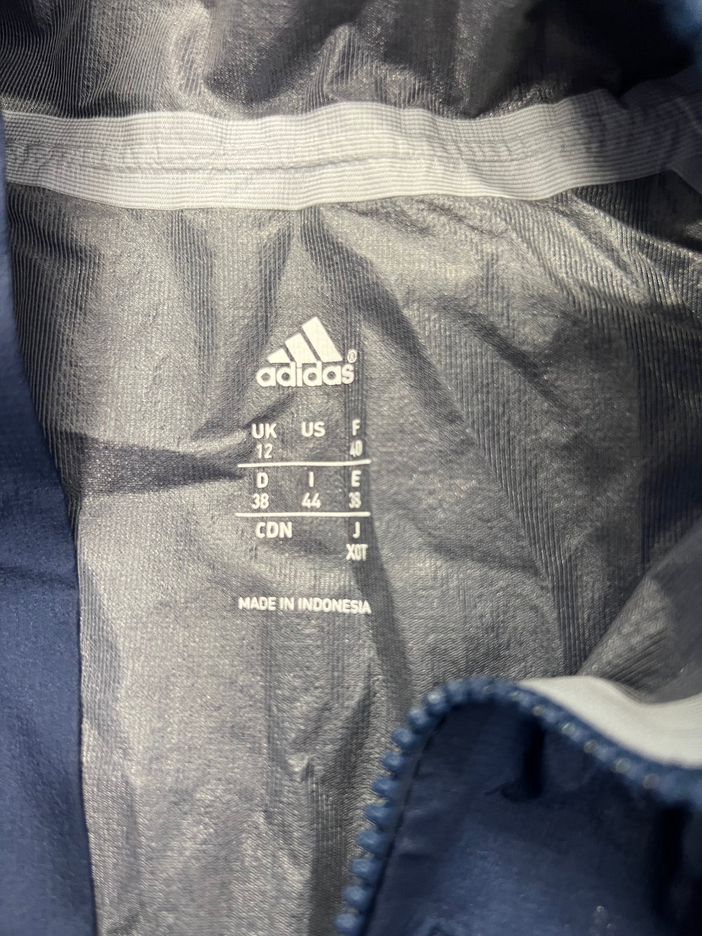 Inside view showing Adidas size label and fabric details