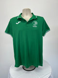 Front view of green Joma men's polo shirt with Portugal Olympic Committee logo on left chest and white Joma brand on right