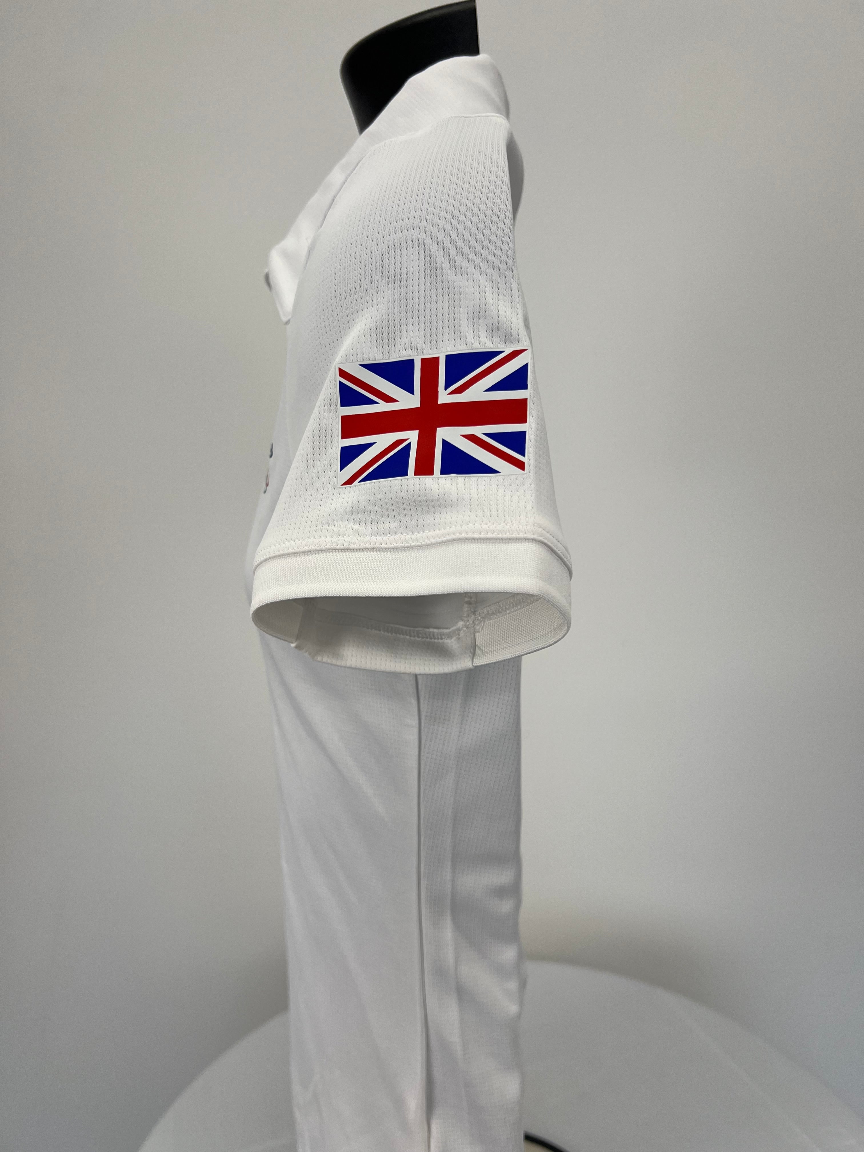 Side view showing Union Jack flag detail on sleeve of white polo top