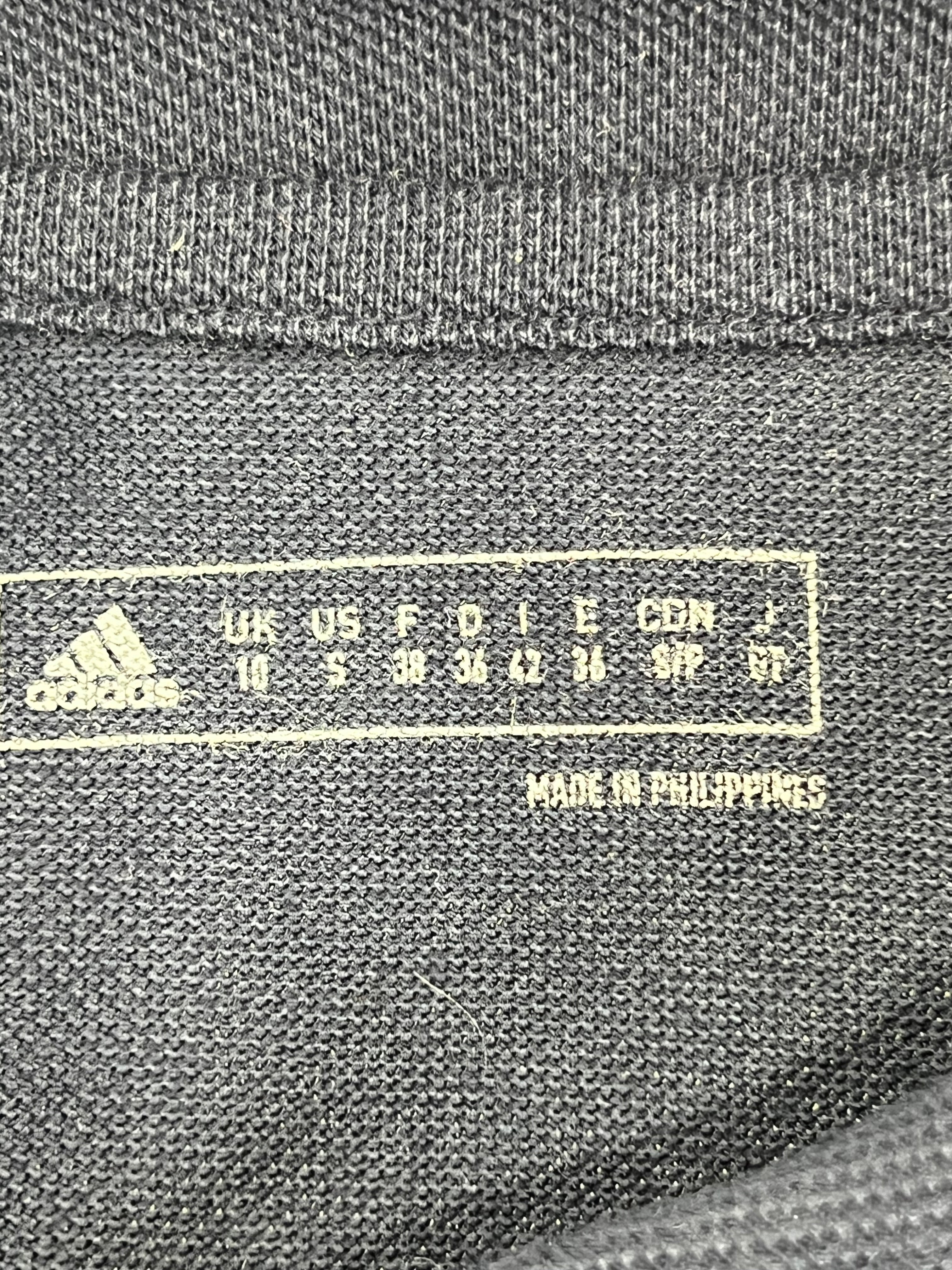 Inside label showing Adidas branding, size information and 'Made in Philippines' text