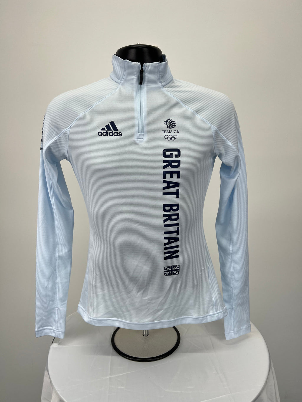 adidas Team GB light blue long sleeve quarter zip top front view on mannequin