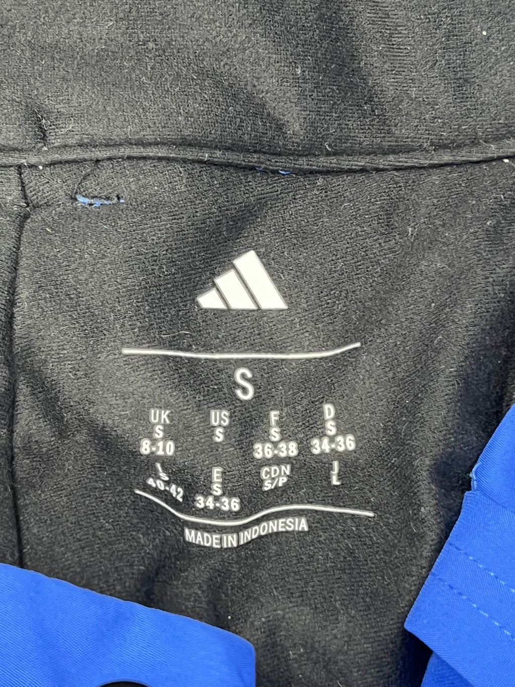 Tag showing size small and adidas logo printed inside the fleece lining