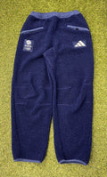 Front view of adidas Team GB navy fleece trousers with pockets and logo patches