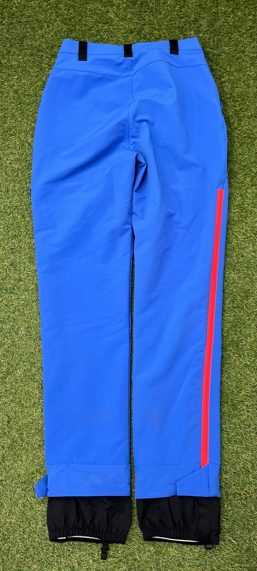 Back view of adidas Team GB women's blue ski trousers showing clean design and red zipper detail