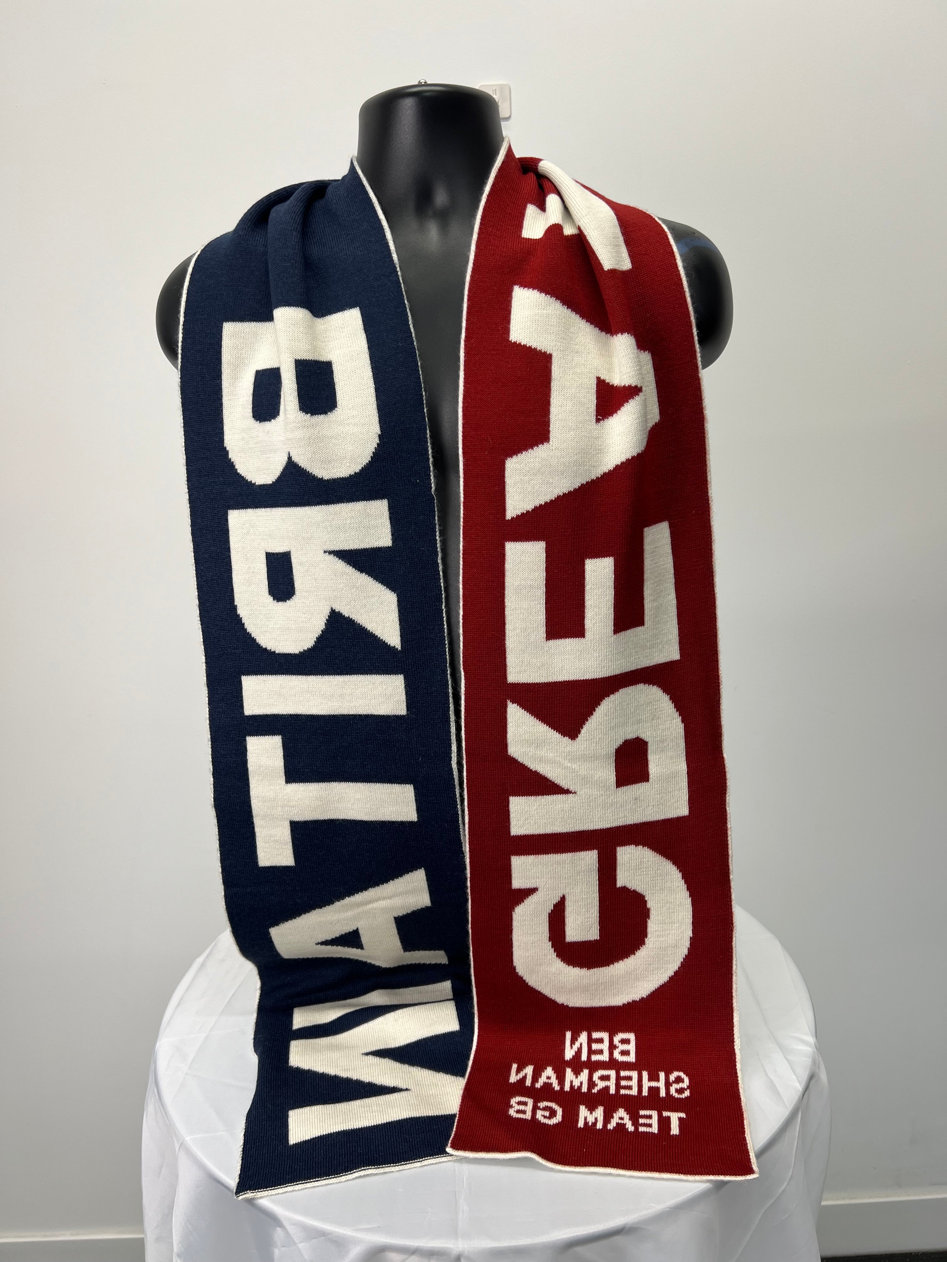 Reverse side of scarf on mannequin showing alternate colour lettering