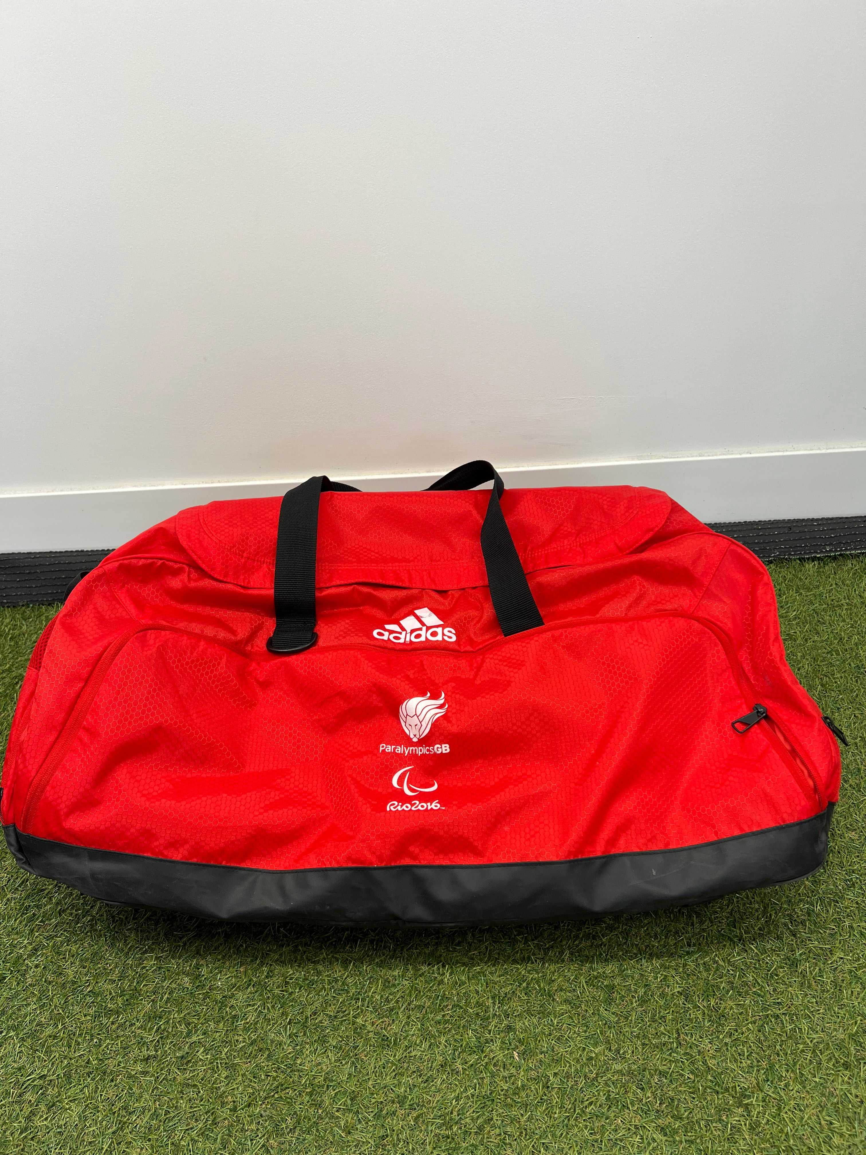 Red Adidas sports bag with black straps and Paralympics GB Rio 2016 logos