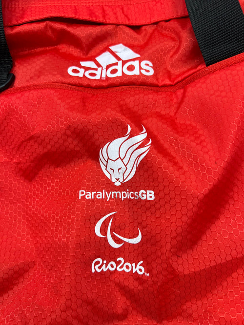 Close up of Adidas logo and Paralympics GB Rio 2016 logos on red fabric