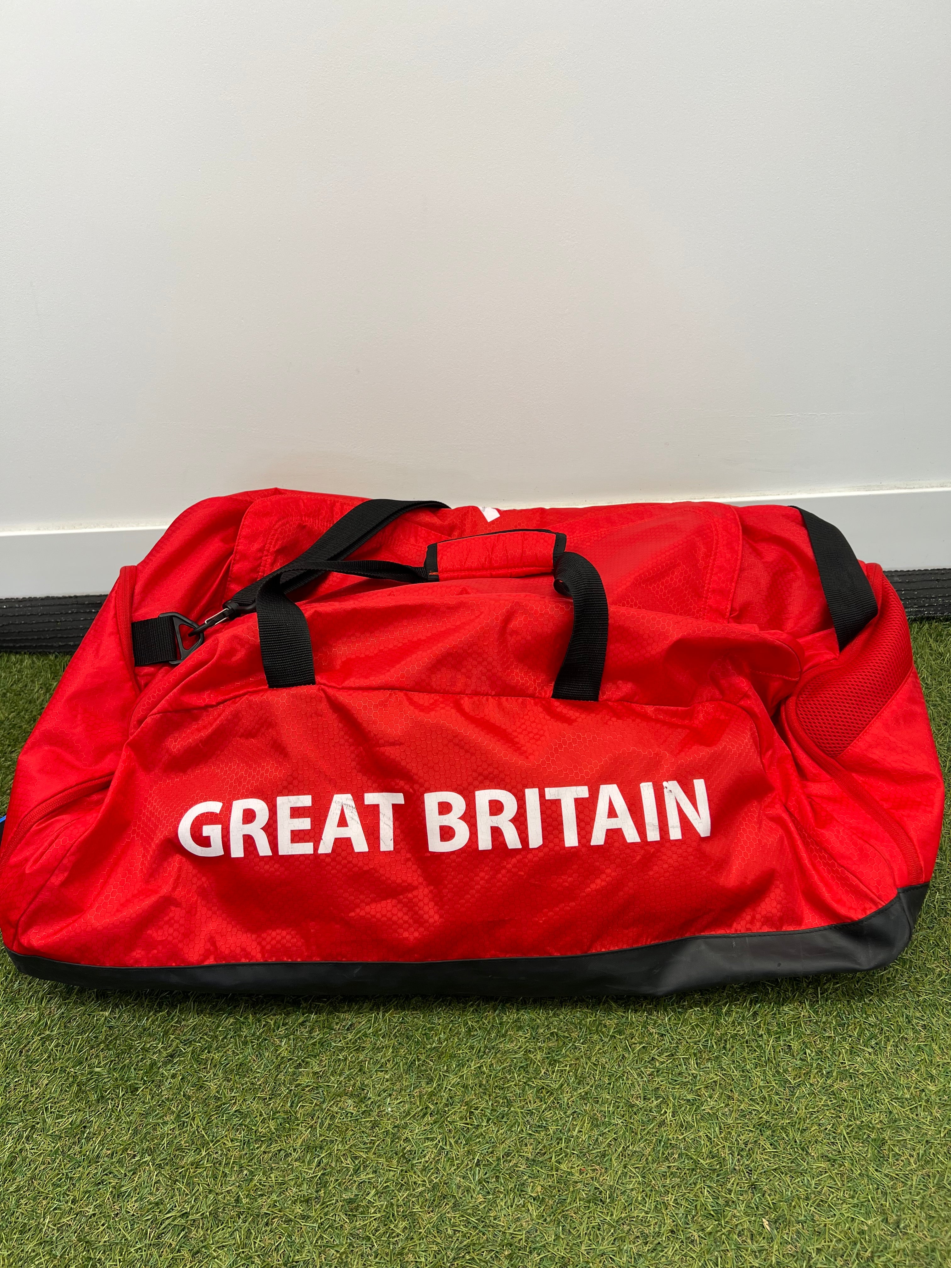 Red Adidas sports bag featuring 'Great Britain' printed in bold white