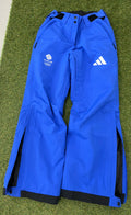 Front view of women's blue adidas Team GB snow sports fleece lined trousers showing logos and zip pockets