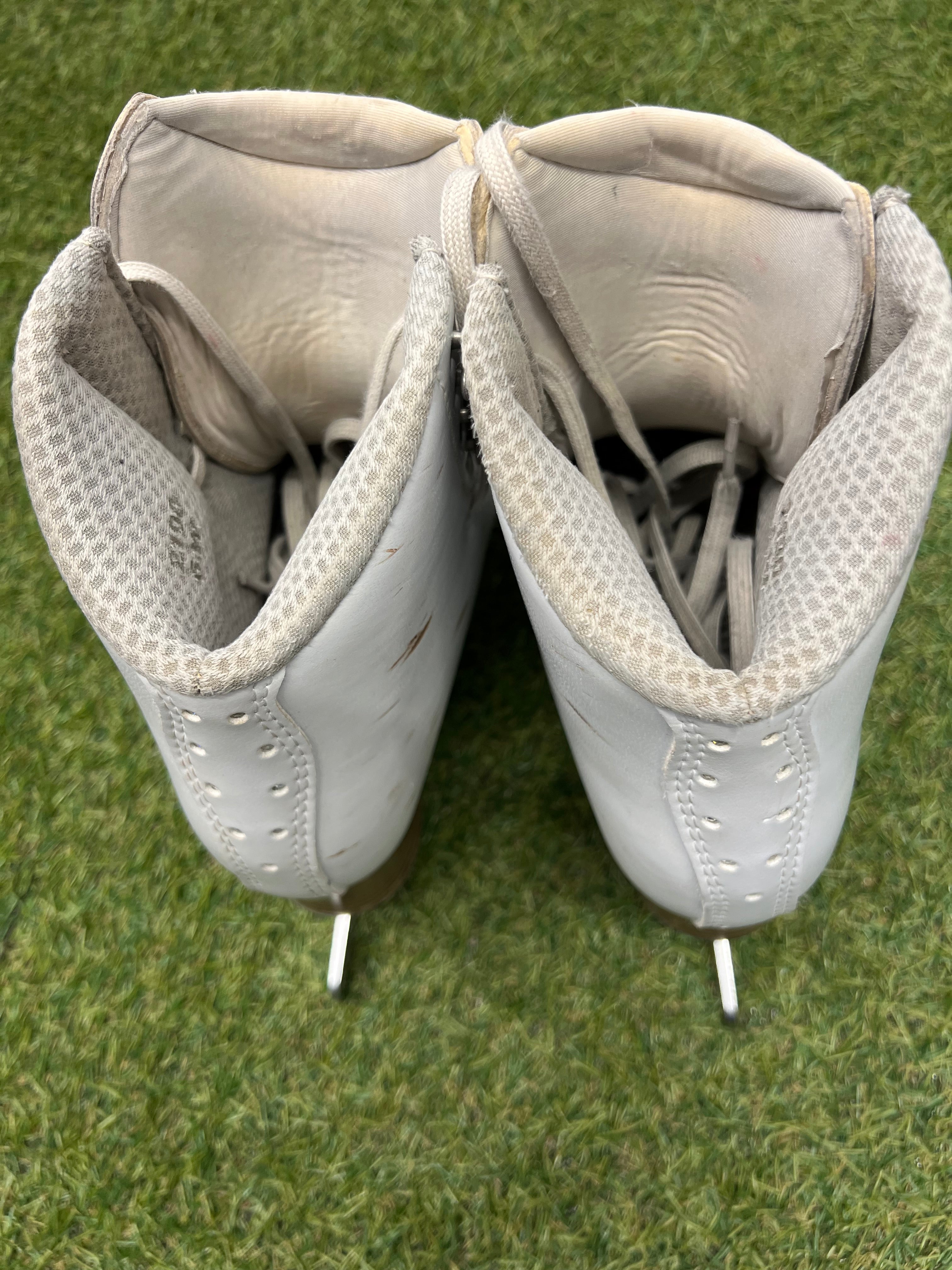 Top view of figure skate openings showing soft interior padding and tongue