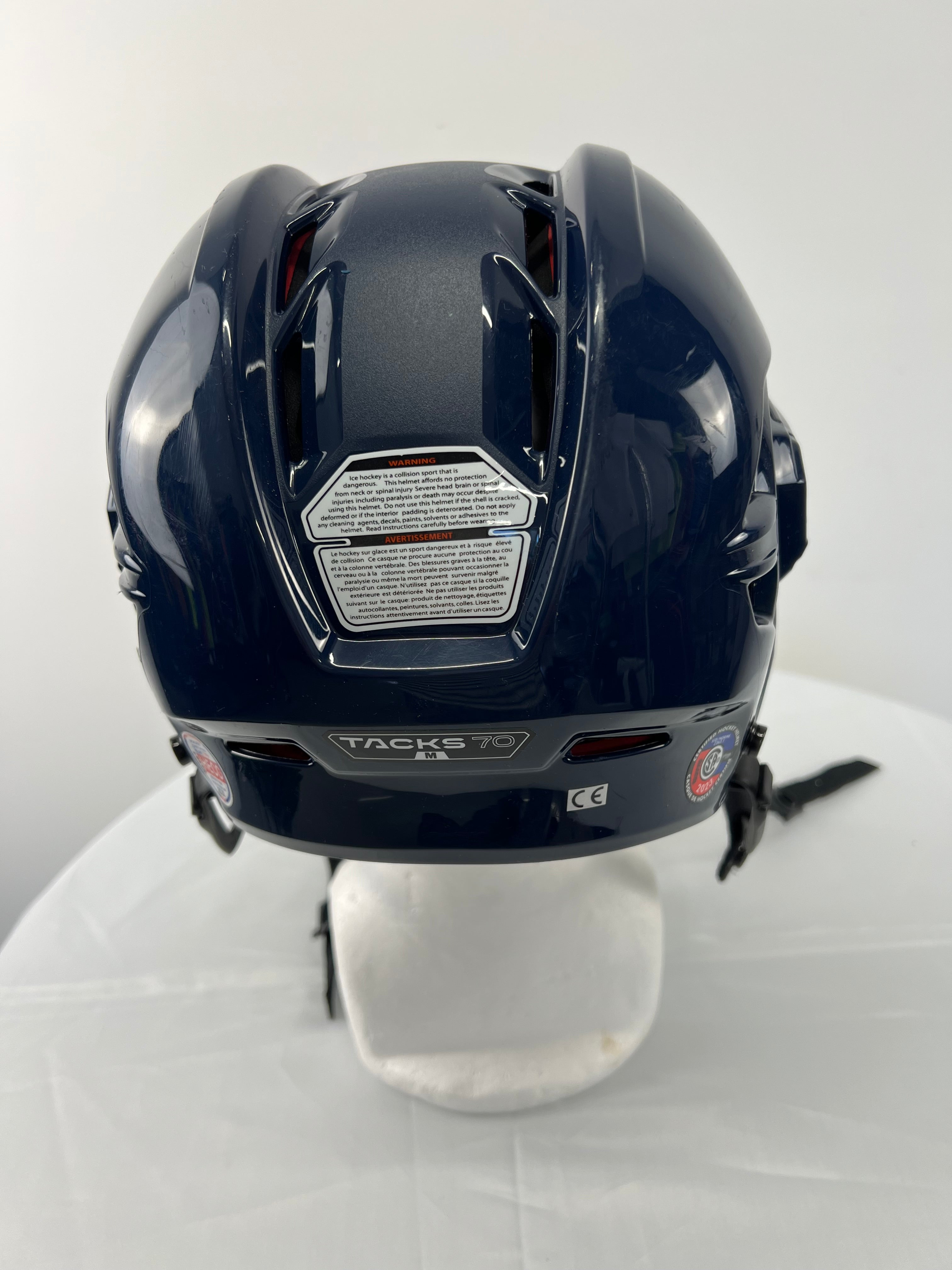 Opposite side view of CCM Tacks 70 youth hockey helmet with face guard