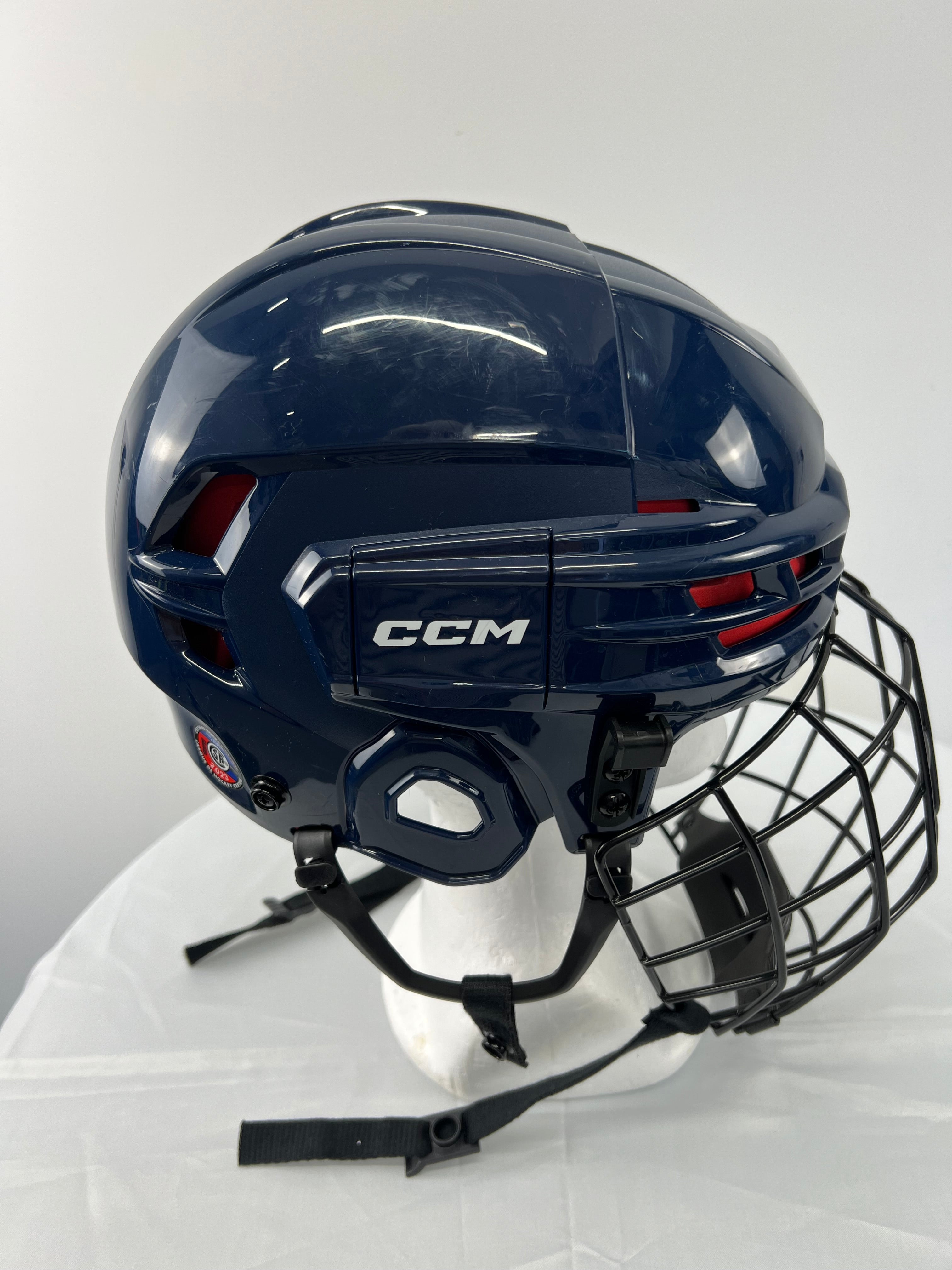 Top-down view of interior padding and chin strap on youth hockey helmet