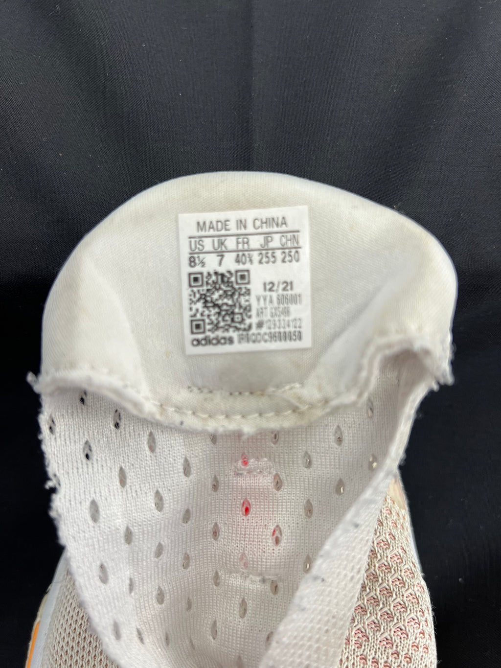 Inside label of adidas Solar Glide shoe showing size and manufacturing details