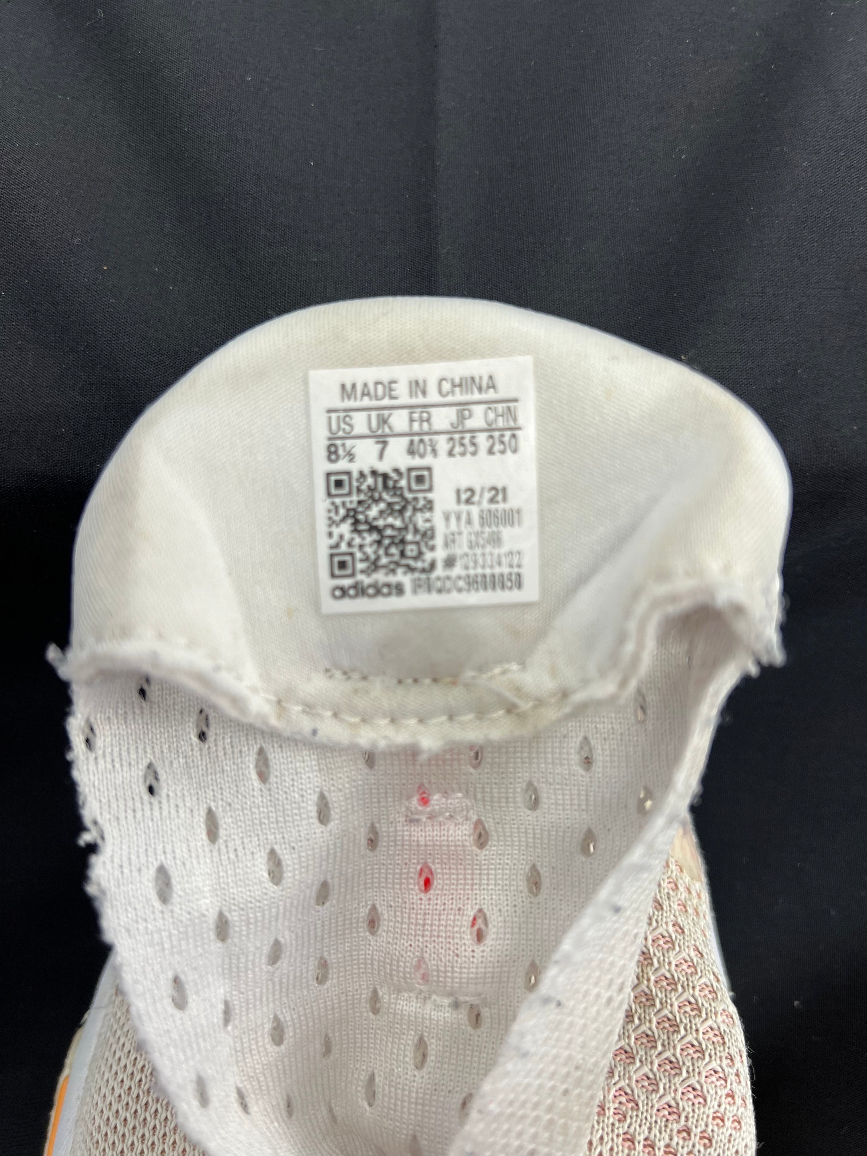 Inside label of adidas Solar Glide shoe showing size and manufacturing details