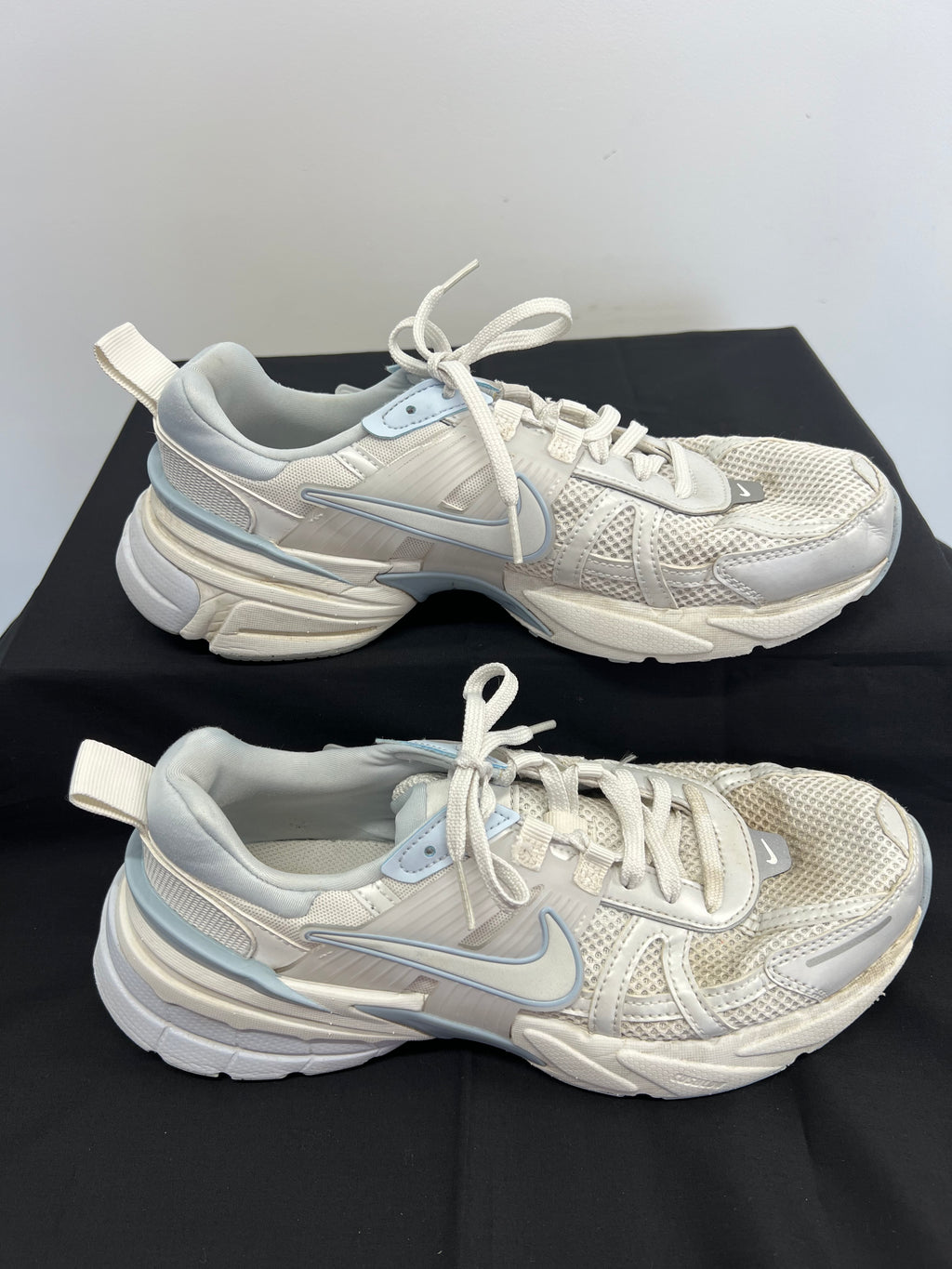 Side view of Nike V2K Run Platinum Tint sneakers highlighting swoosh logo and sole design