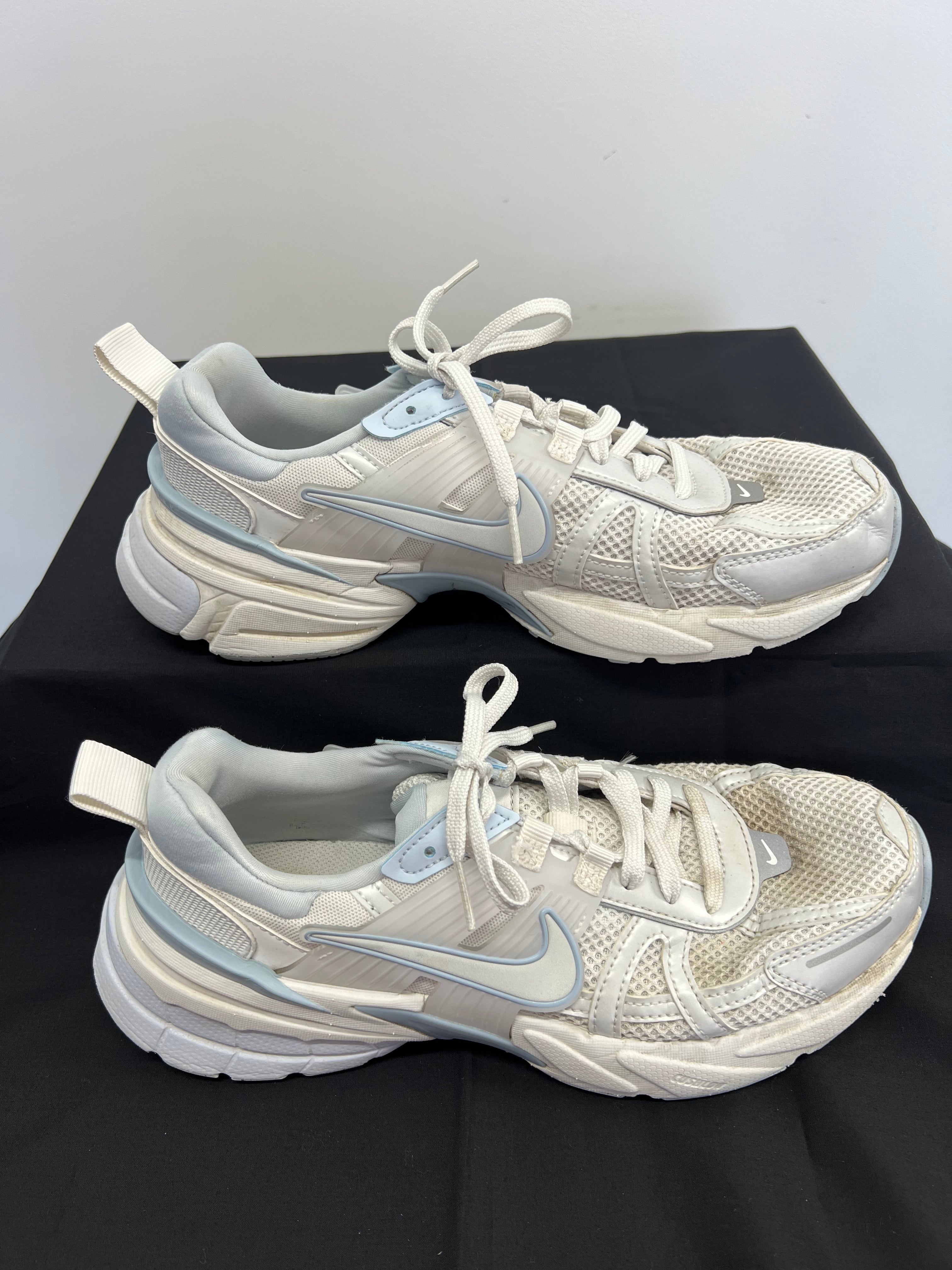 Side view of Nike V2K Run Platinum Tint sneakers highlighting swoosh logo and sole design