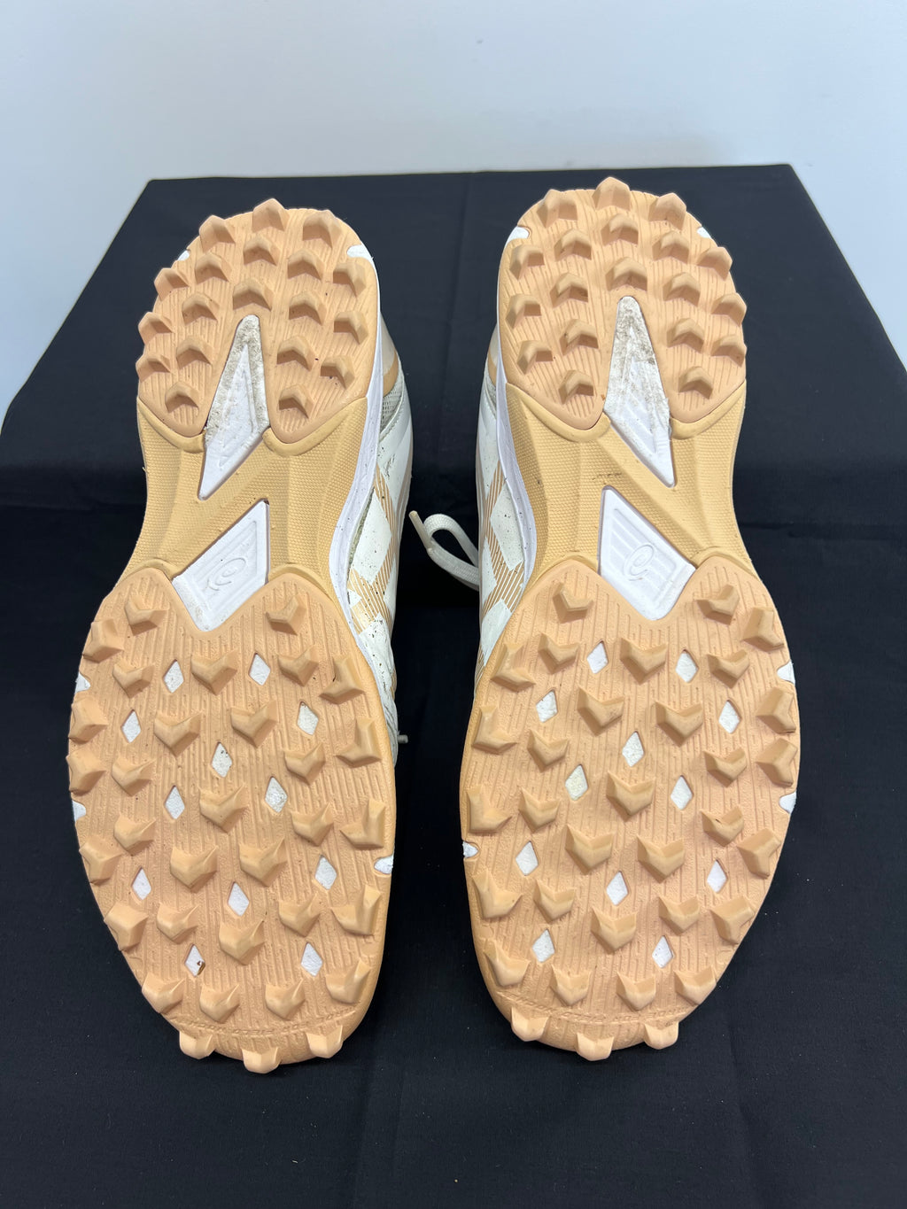 Close-up of rubber studded outsole designed for turf traction