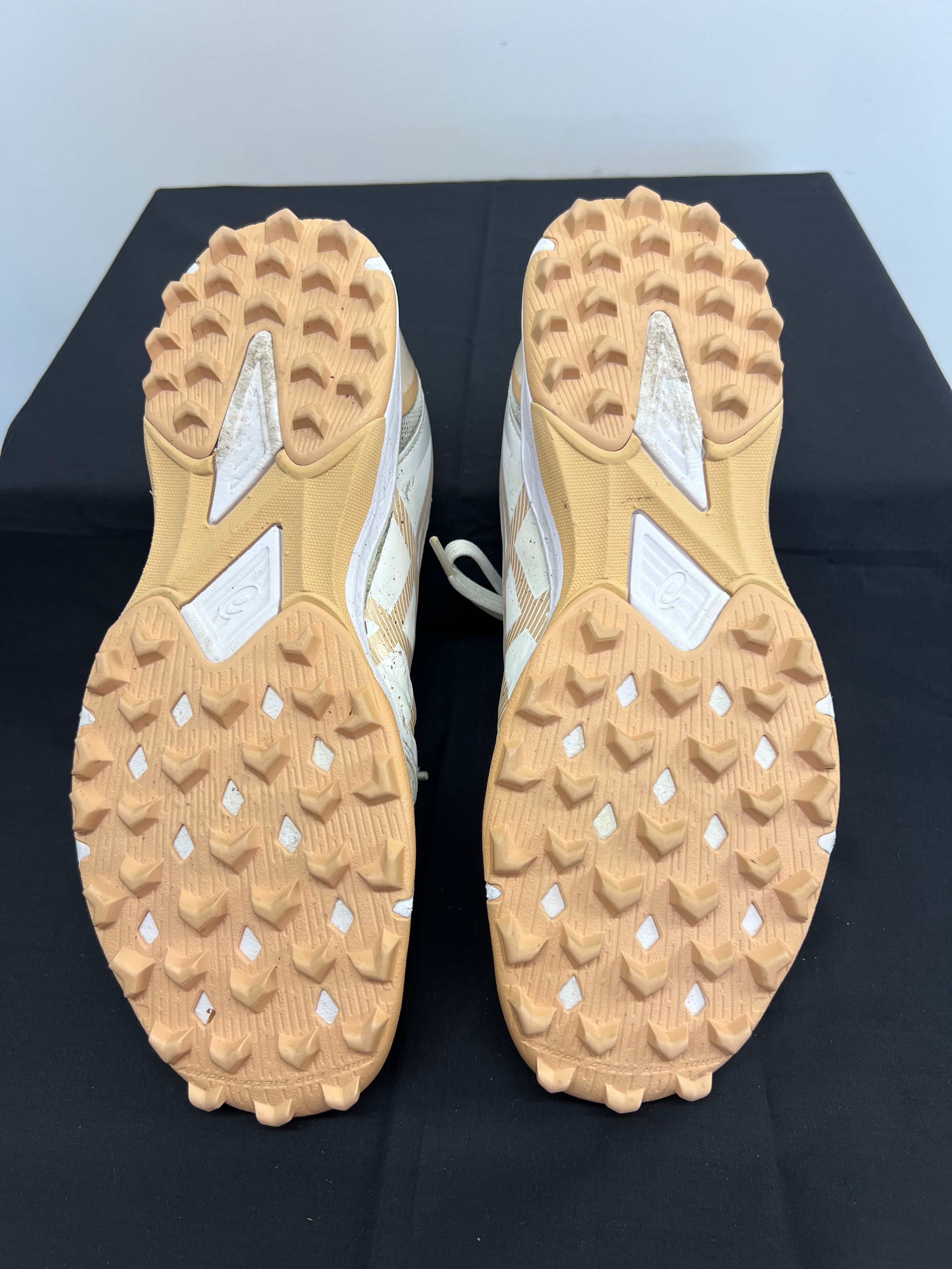 Close-up of rubber studded outsole designed for turf traction