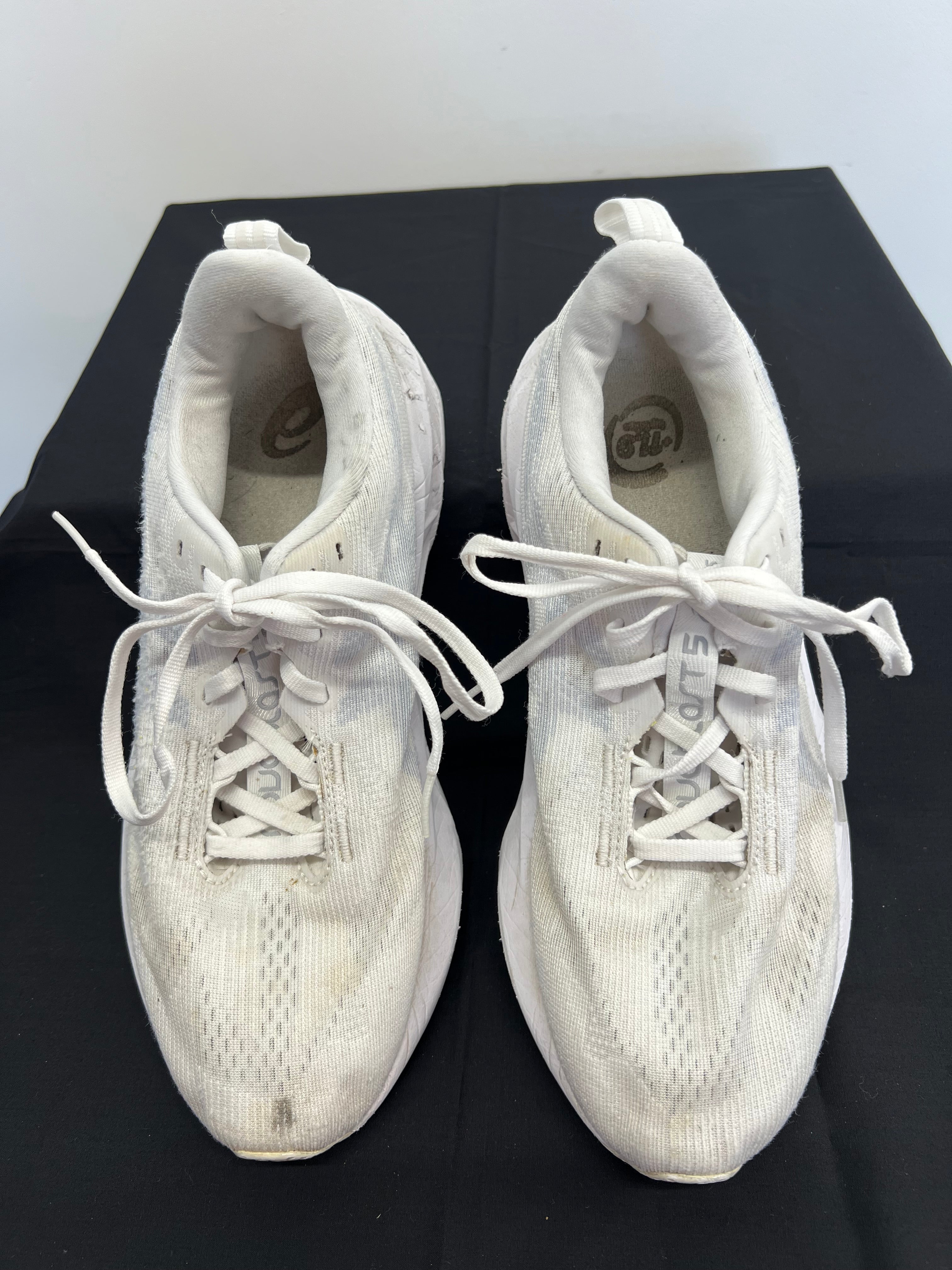 Front view of white Asics Novablast 5 running trainers showing laces and toe area