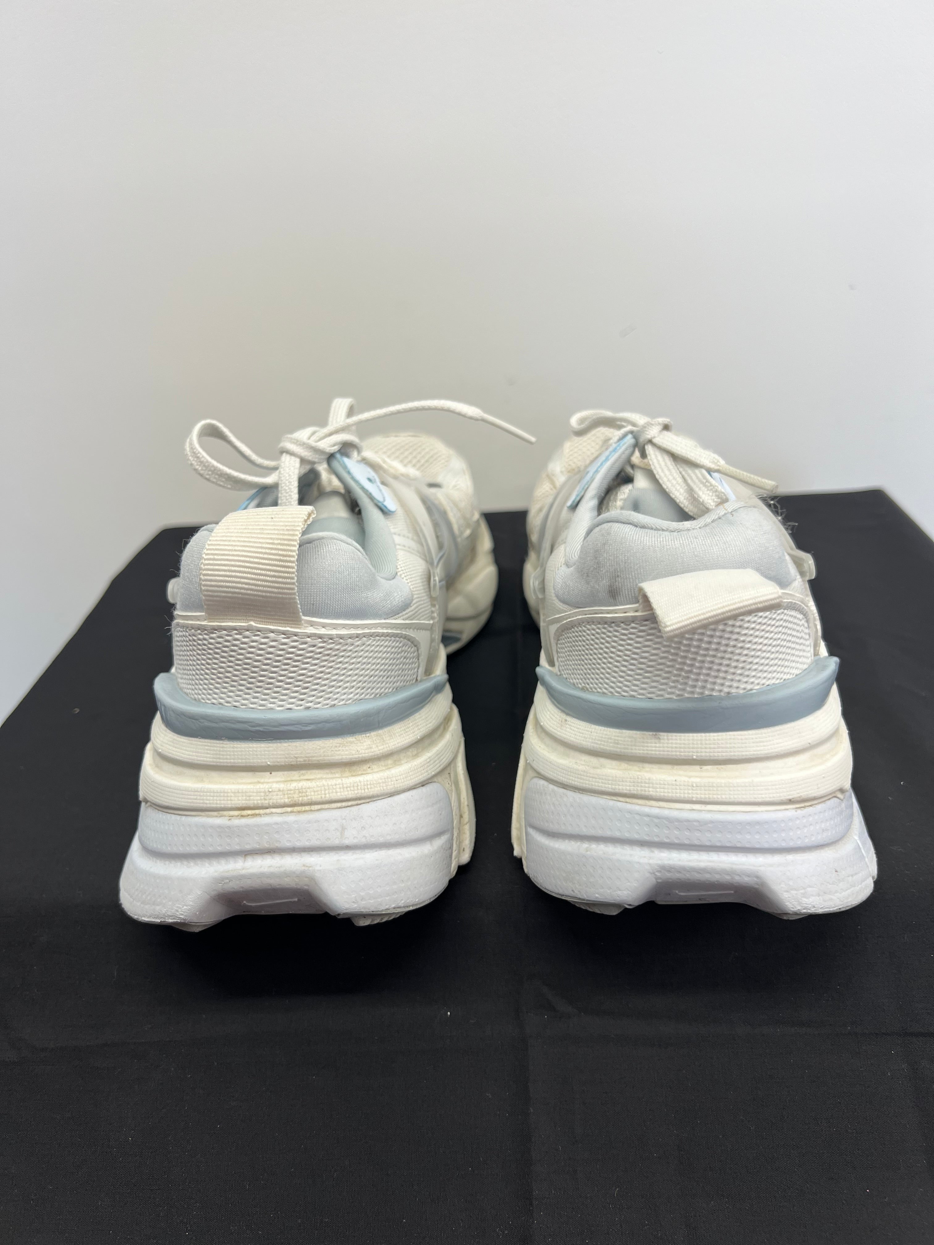Rear view of Nike V2K trainers revealing padded collar and pull tab