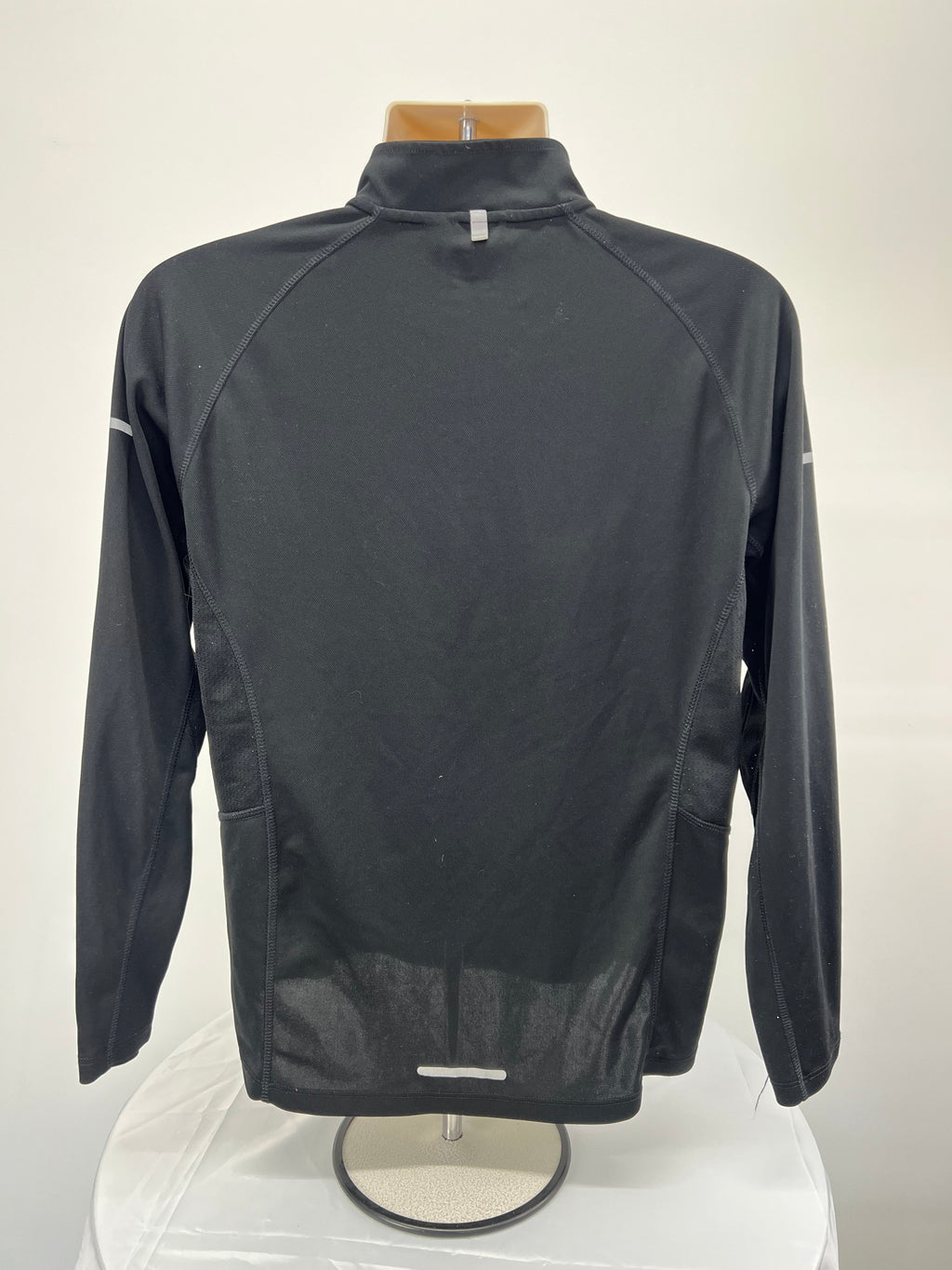 Back view of black Karrimor men's running half-zip top showing reflective strip and mesh panels