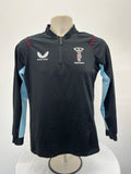 Front view of Castore Harlequins women's long-sleeve black training top with light blue sleeve panels and red piping