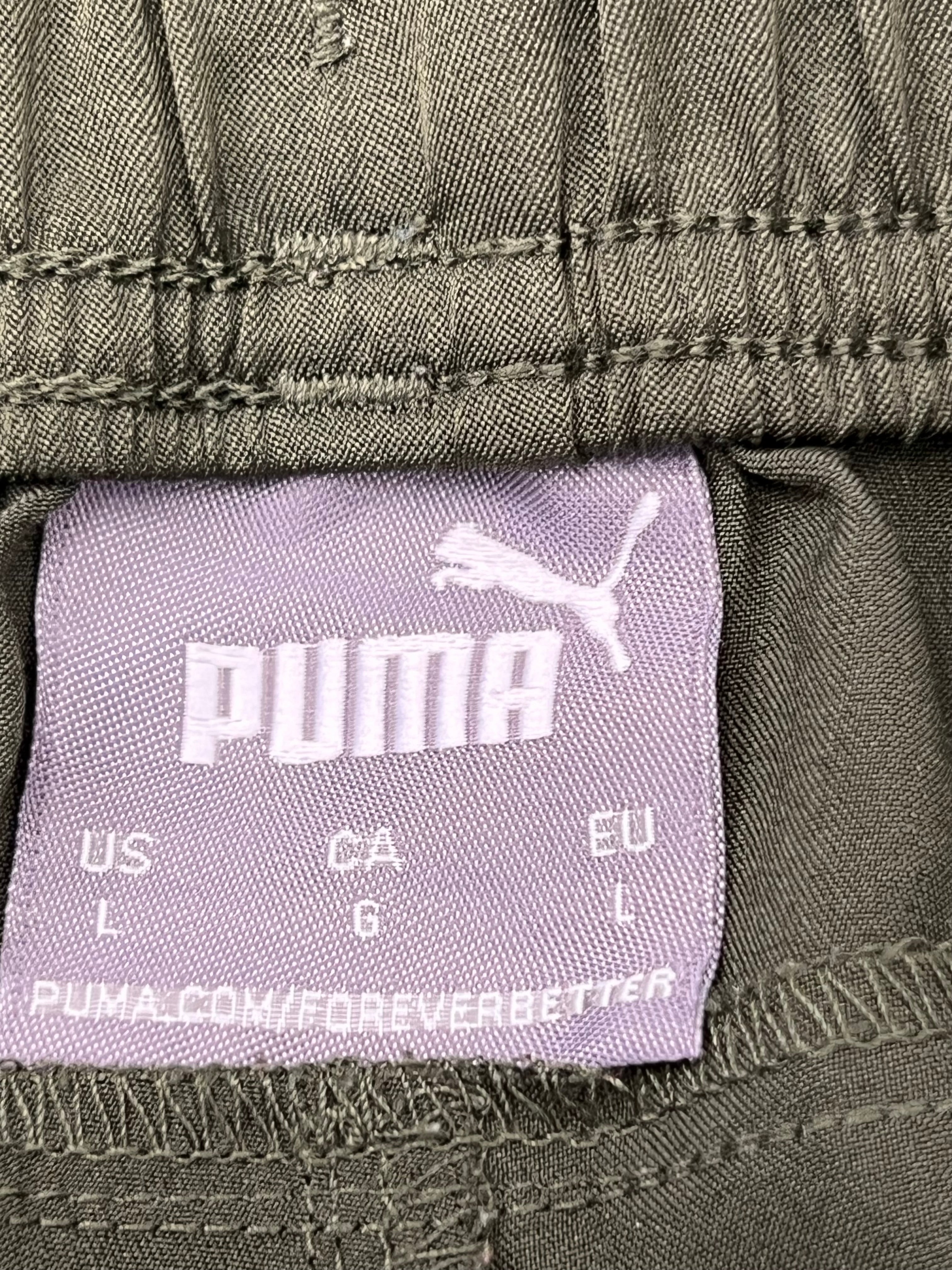 Close-up of Puma size label inside men's sports shorts