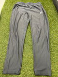 Front view of Under Armour men’s fitted grey tracksuit bottoms with elastic waistband