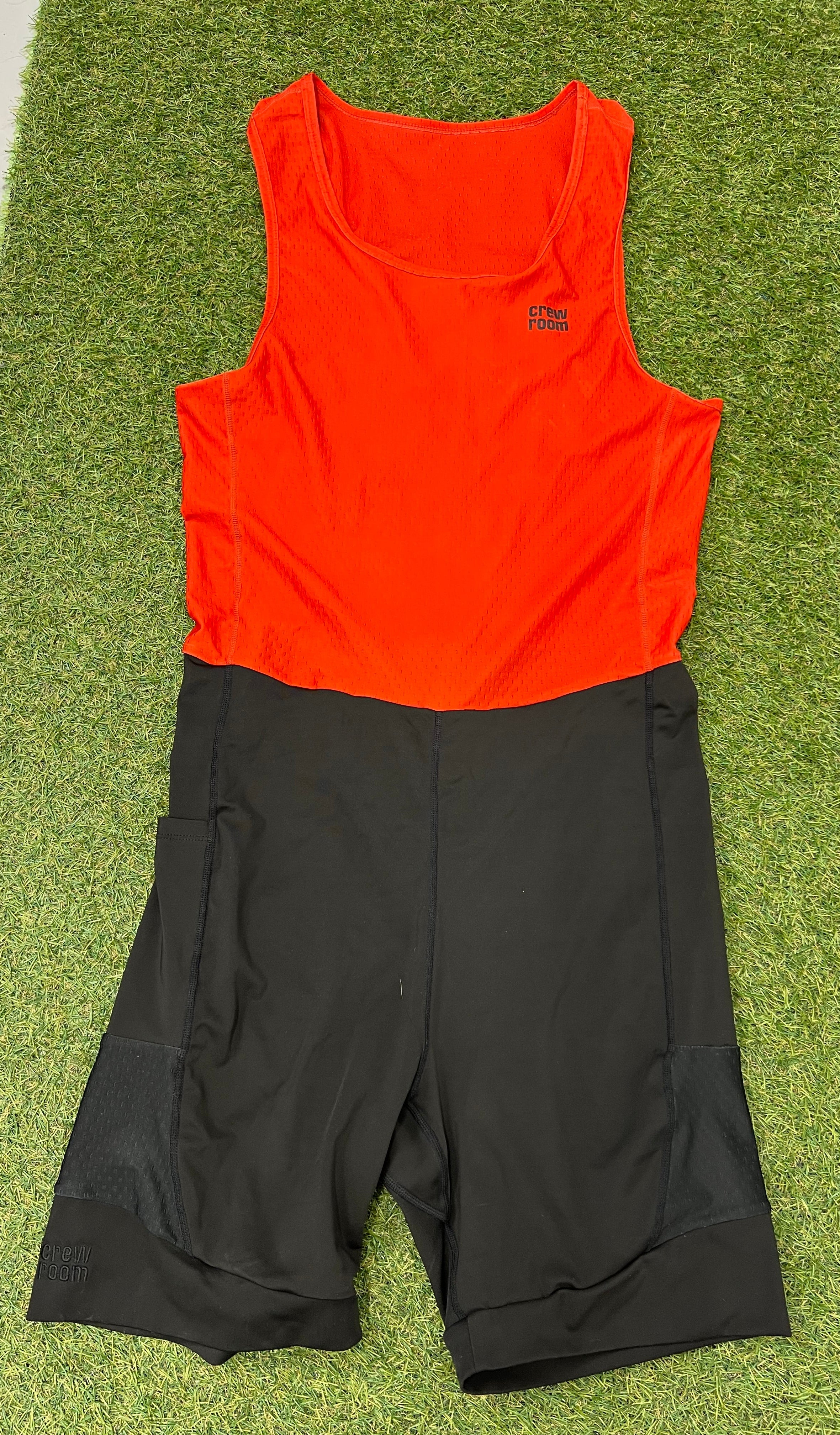 Front view of Men's Crewroom rowing suit with red sleeveless mesh top and black shorts