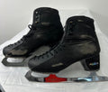 Pair of black Aura SKY 200 figure skating boots with visible scuffs and surface wear on leather and carbon fibre heel