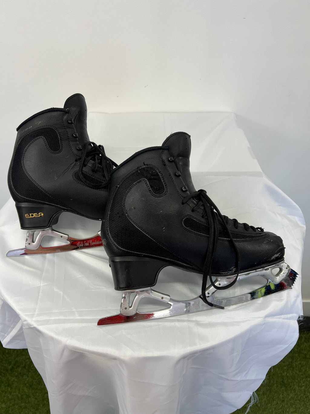 Opposite side view of EDEA Ice Fly skates showing black synthetic leather and mesh with moderate wear