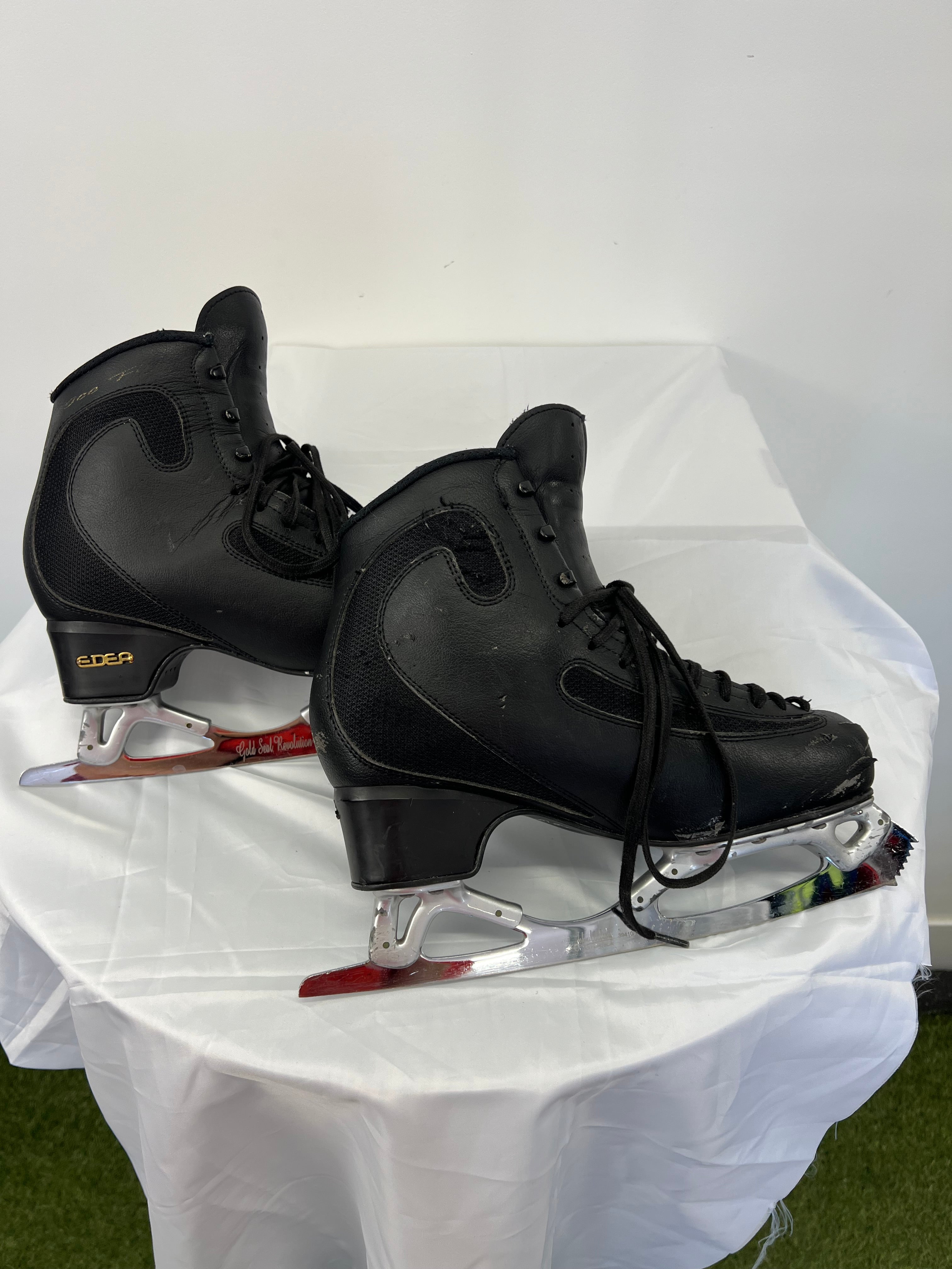 Opposite side view of EDEA Ice Fly skates showing black synthetic leather and mesh with moderate wear
