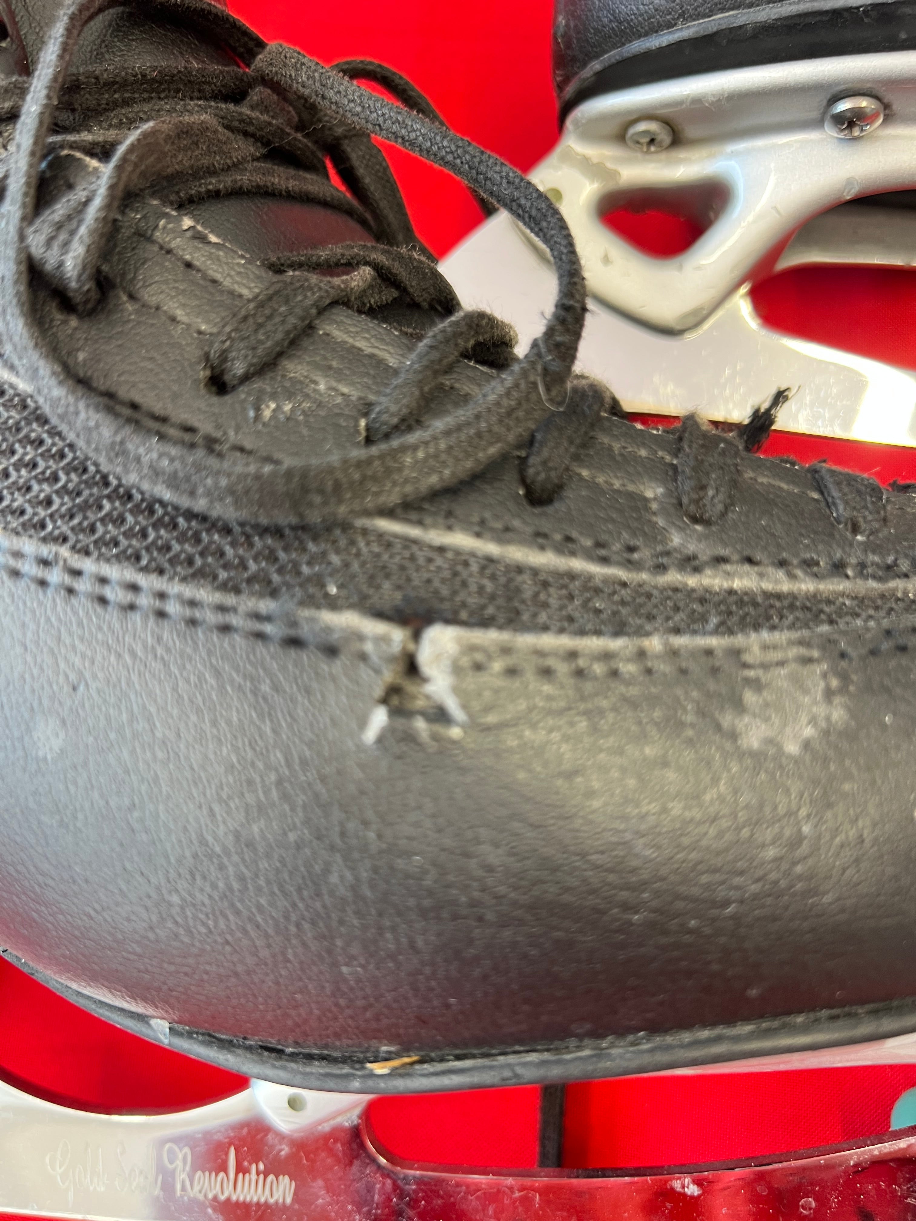 Close-up detail of scratches and scuffs on synthetic leather near laces of EDEA Ice Fly figure skate