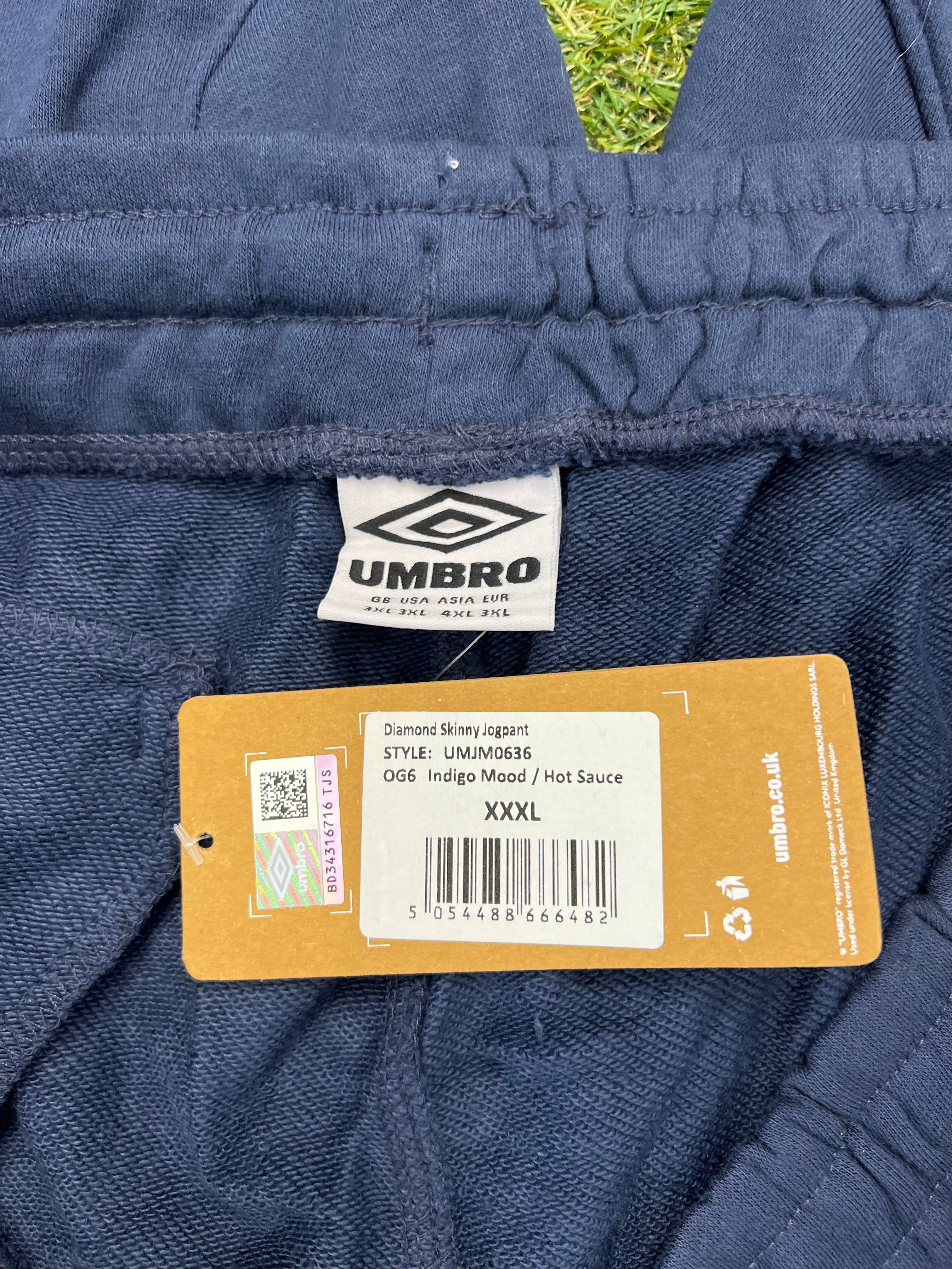 Close-up of Umbro brand label and product tag detailing size and style