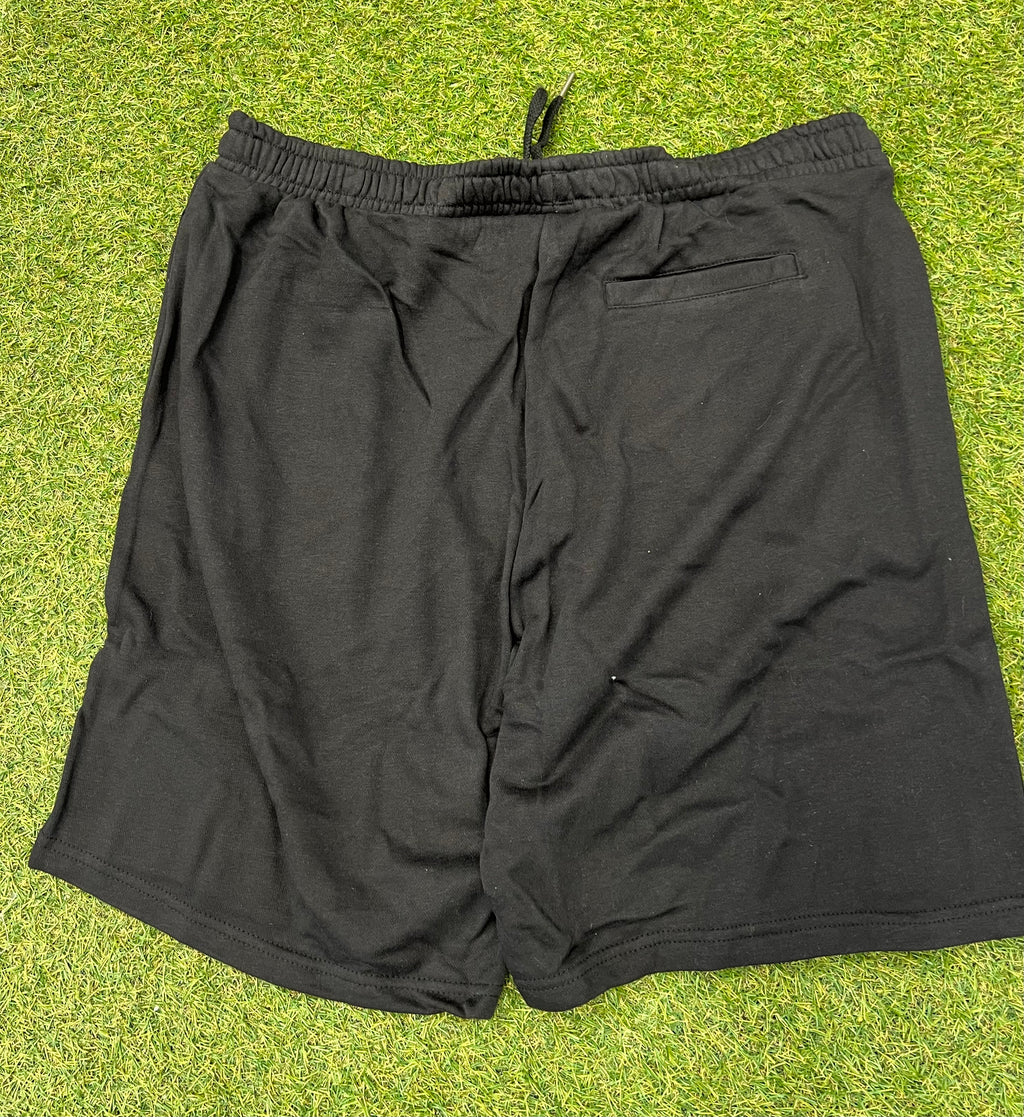 Rear view of black Umbro Diamond Jog Shorts showing back pocket and elastic waistband