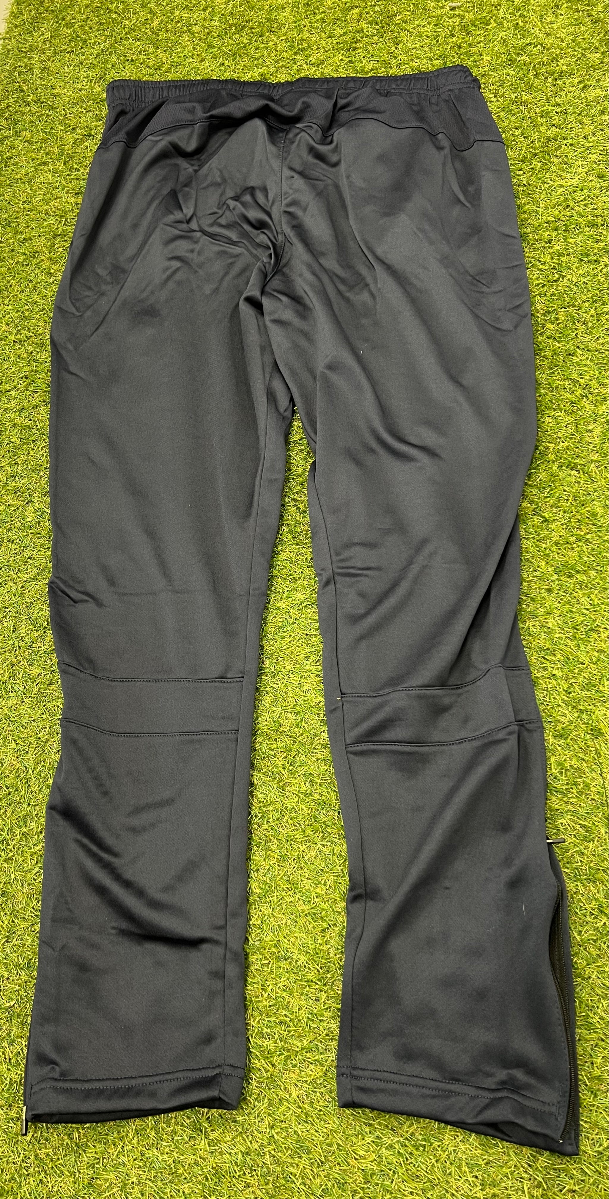 Back view of London Irish BLK black tracksuit trousers with smooth fabric and elastic waistband
