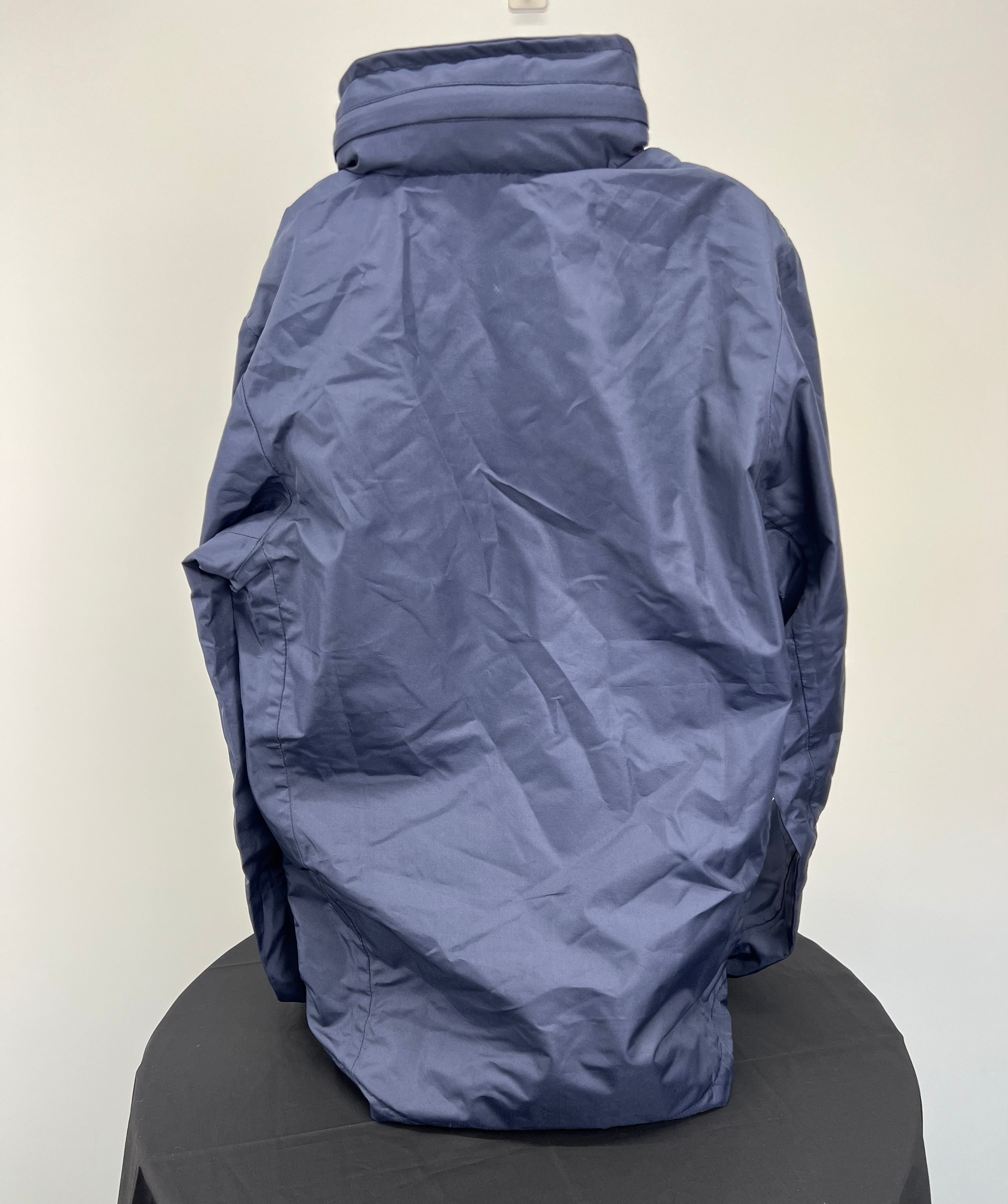 Back view of navy Youth London Irish lightweight jacket showing smooth fabric and hidden hood collar