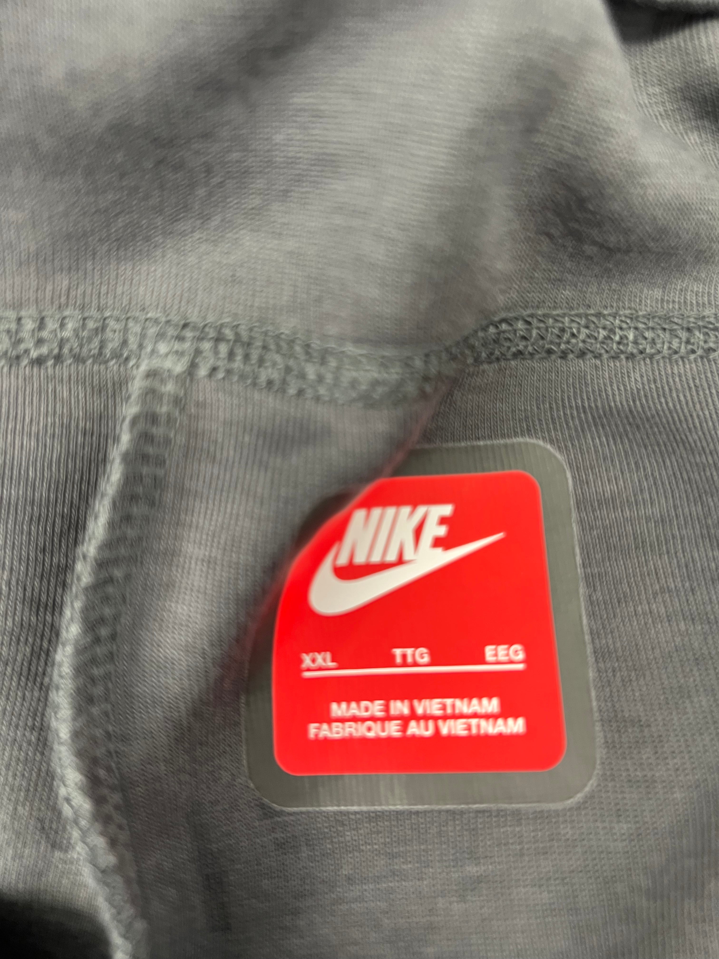 Size label showing Nike logo with size XXL and made in Vietnam tag inside the shorts