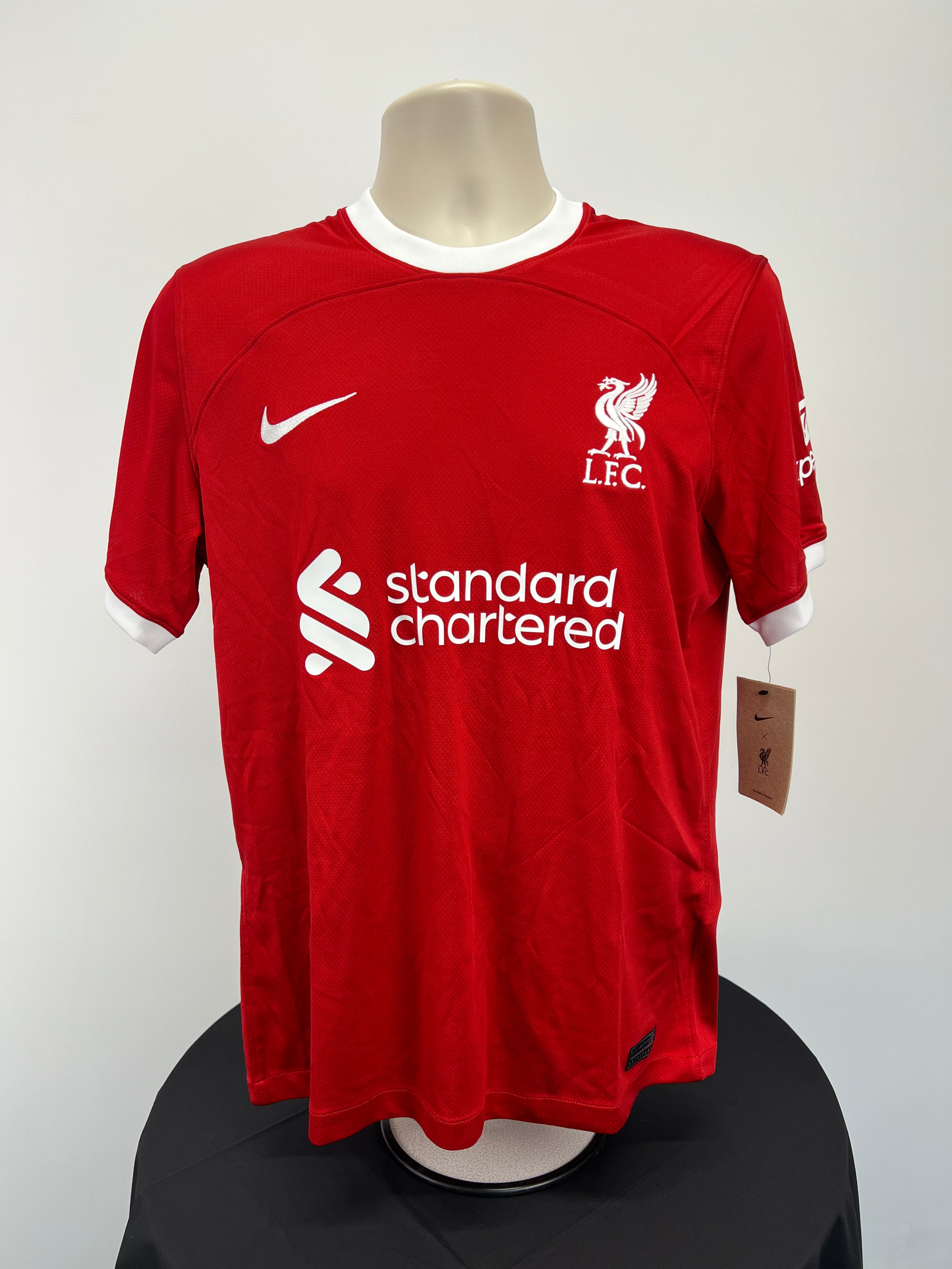 Front view of Liverpool FC men's home football jersey in red with white collar and sleeve trim