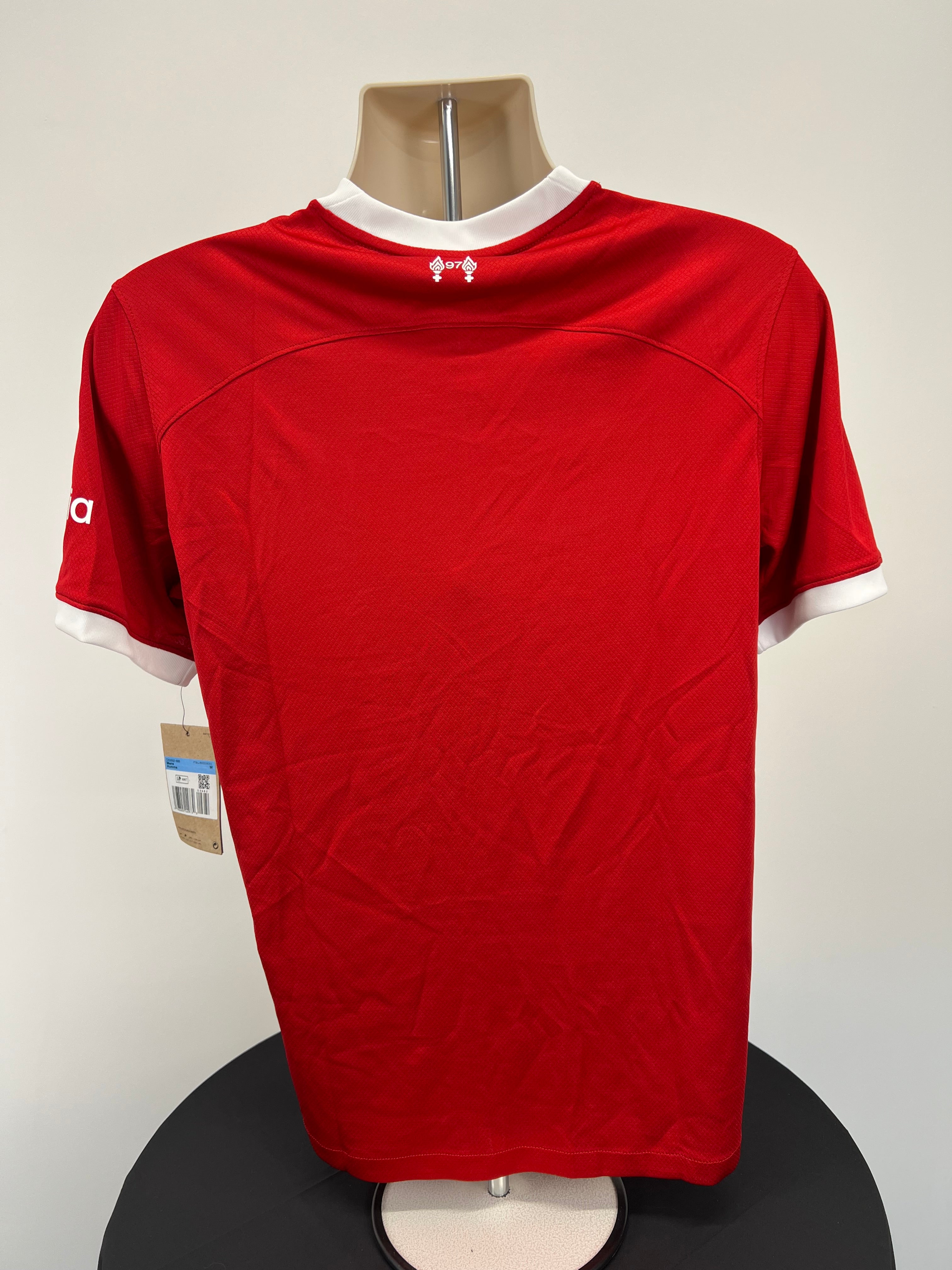 Back view of Liverpool FC men's football jersey showing plain red fabric and white collar trim