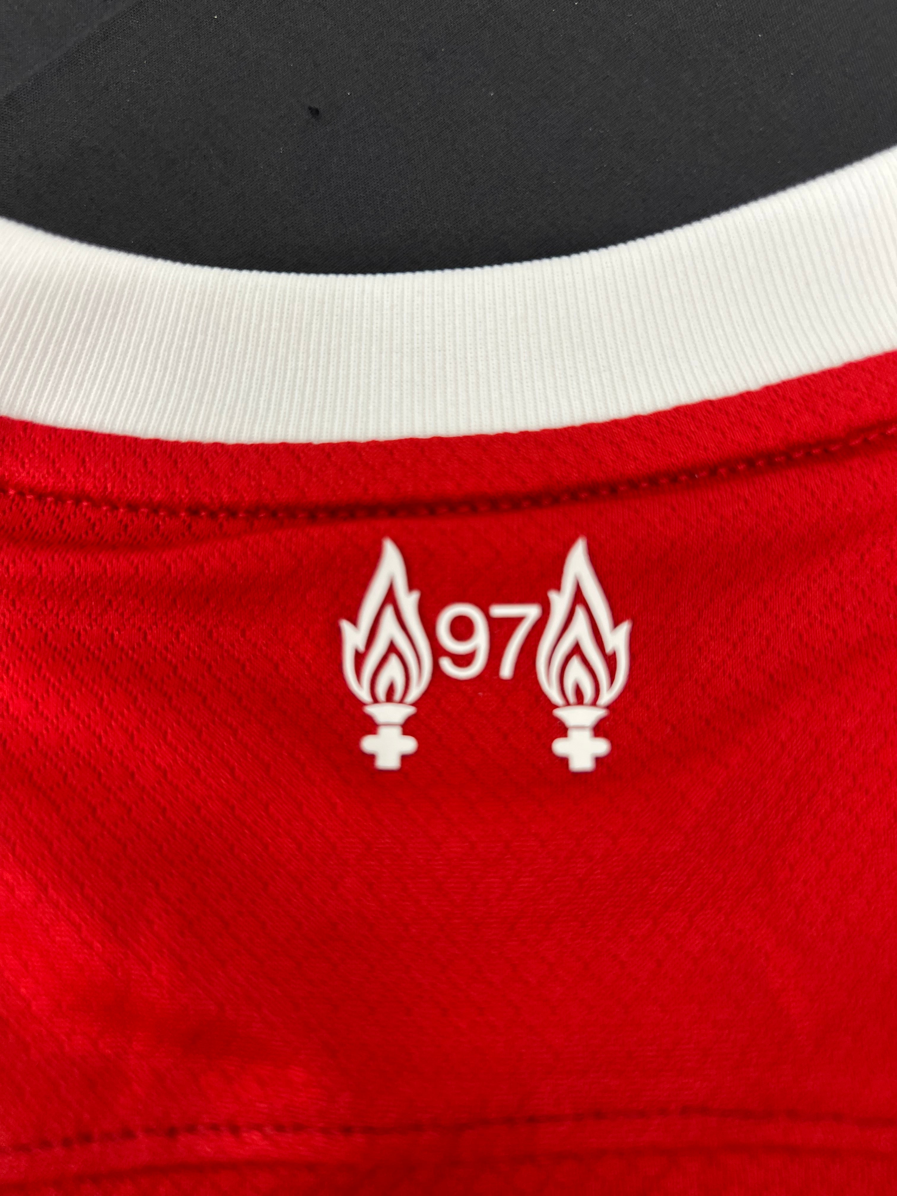 Close-up of back neckline detail with two flames and number 97 commemorative logo