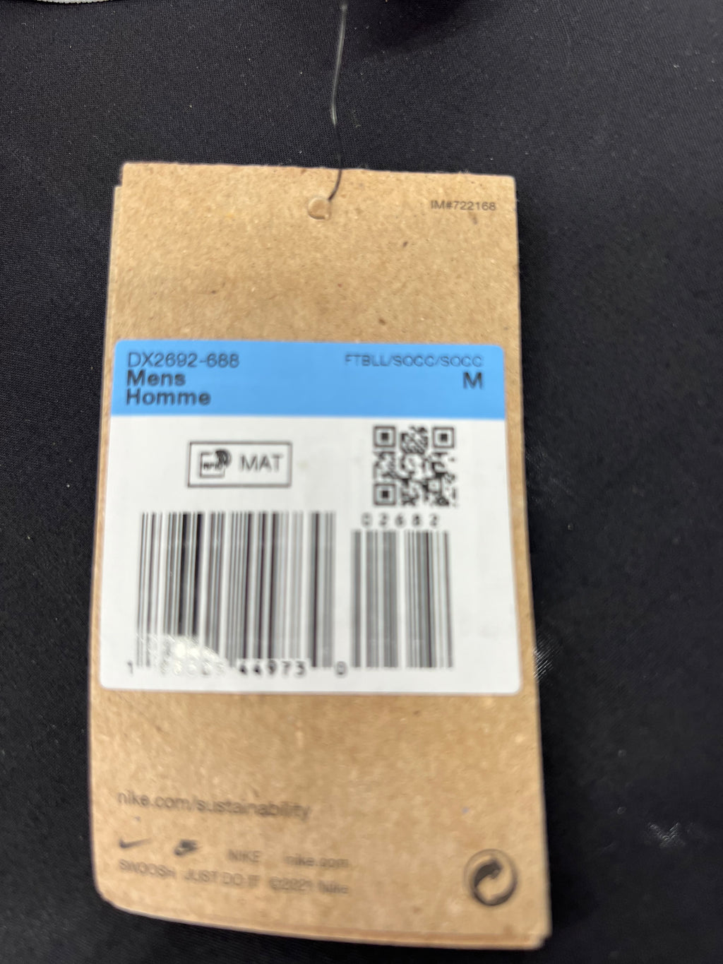Barcode and product information tag on Liverpool FC Nike jersey in size M