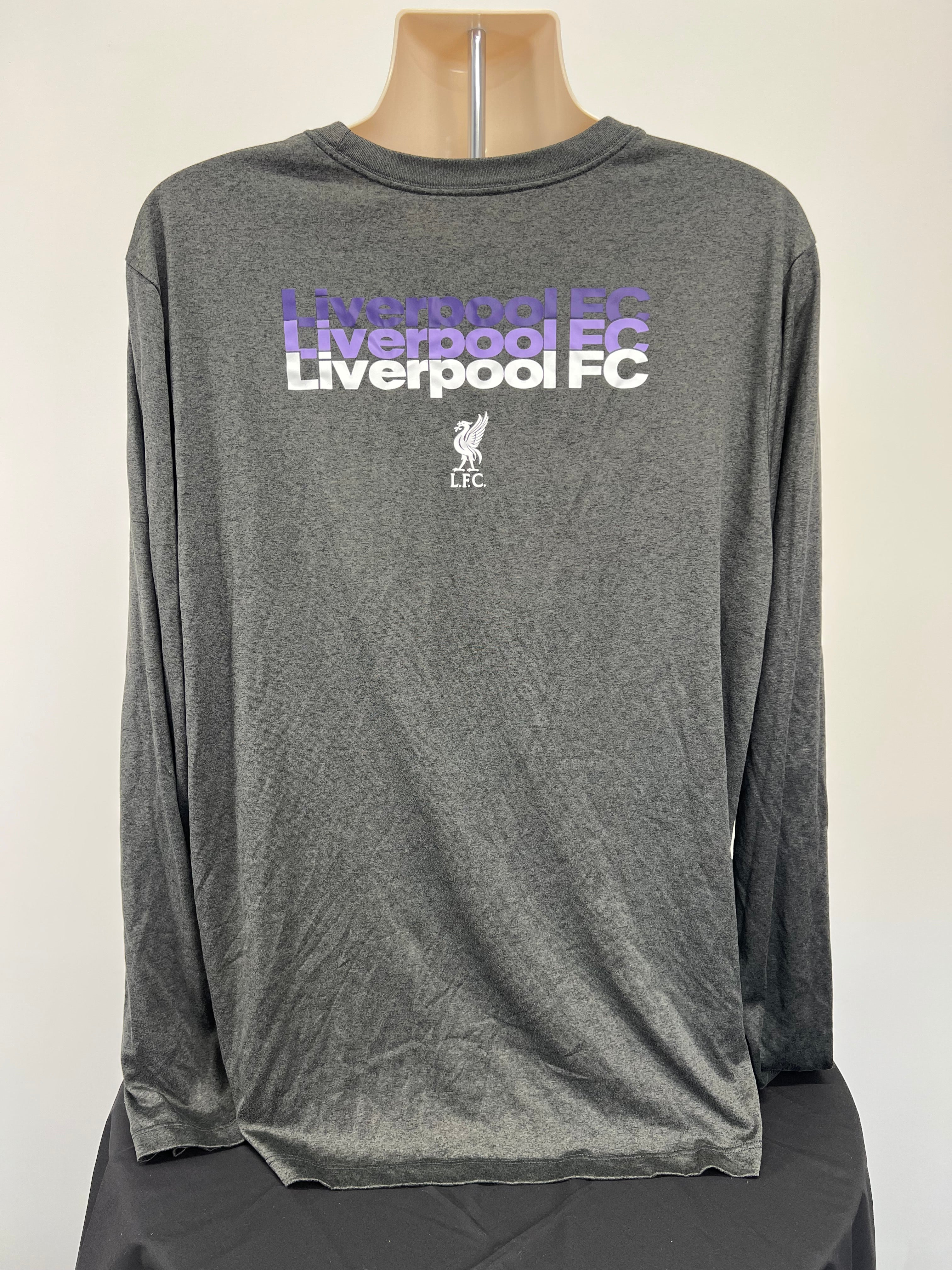 Back view of men's grey Nike Liverpool FC long sleeve training top featuring repeated Liverpool FC text and emblem